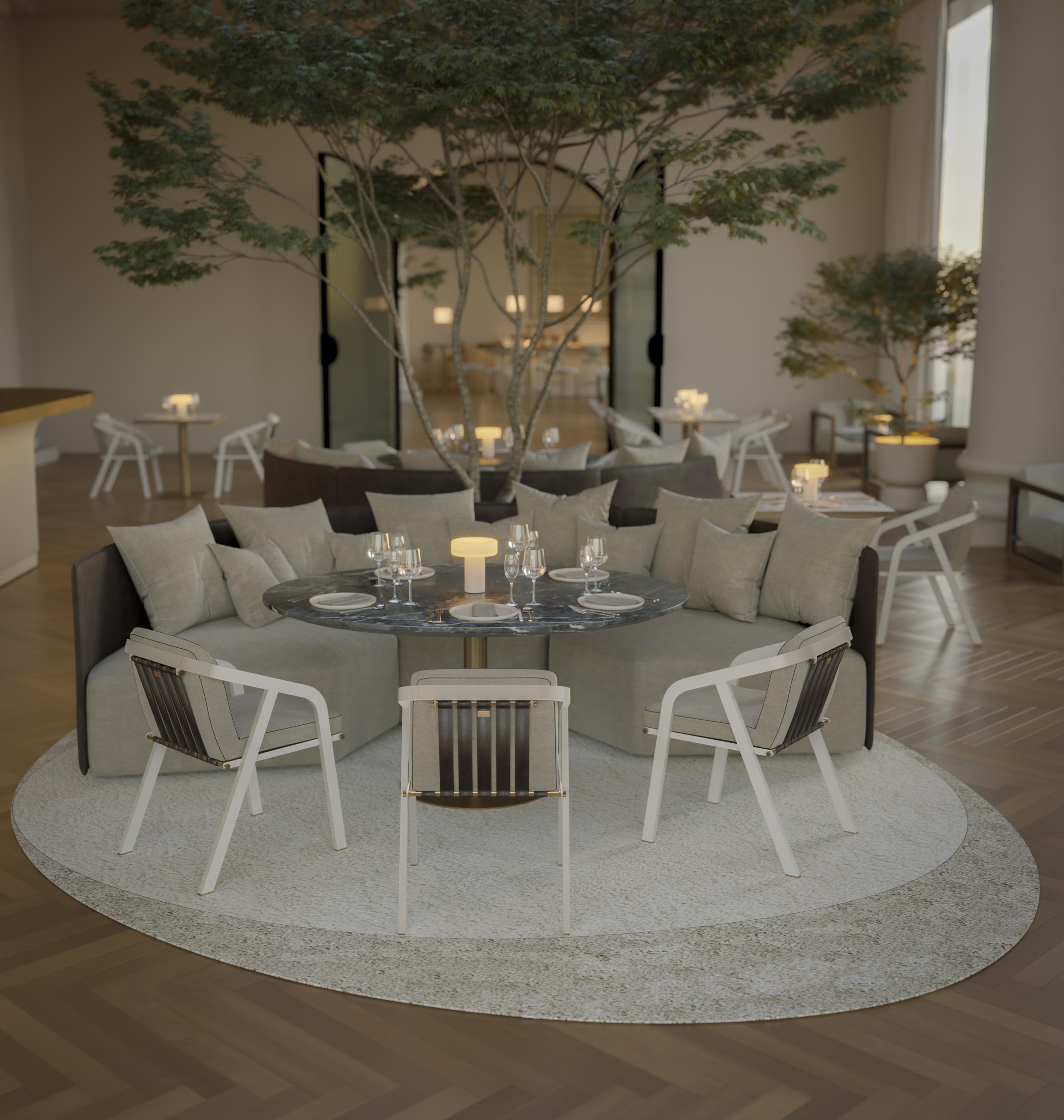 The Dawn round dining table proves to be an attractive option as it features a modern design, perfect for adding a touch of contemporary elegance to your decor.

Its composition features high quality materials, including a marble top and a plated