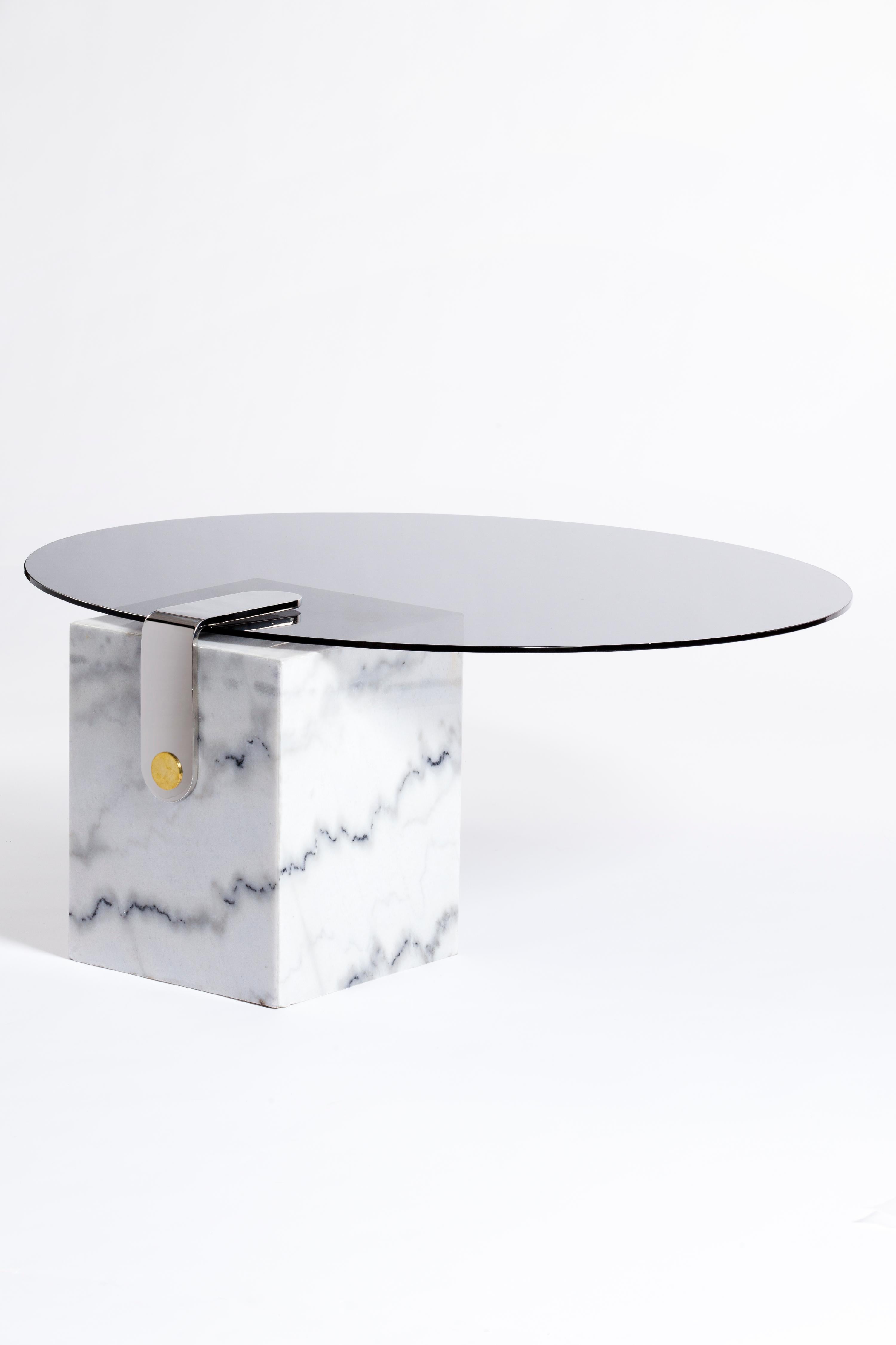 Marble Patch round coffee table by Egg Designs
Dimensions: 80 L X 81 D X 40 H cm
Materials: White Marble, Polished Stainless Steel, Brass Smokey Glass

Founded by South Africans and life partners, Greg and Roche Dry - Egg is a unique perspective