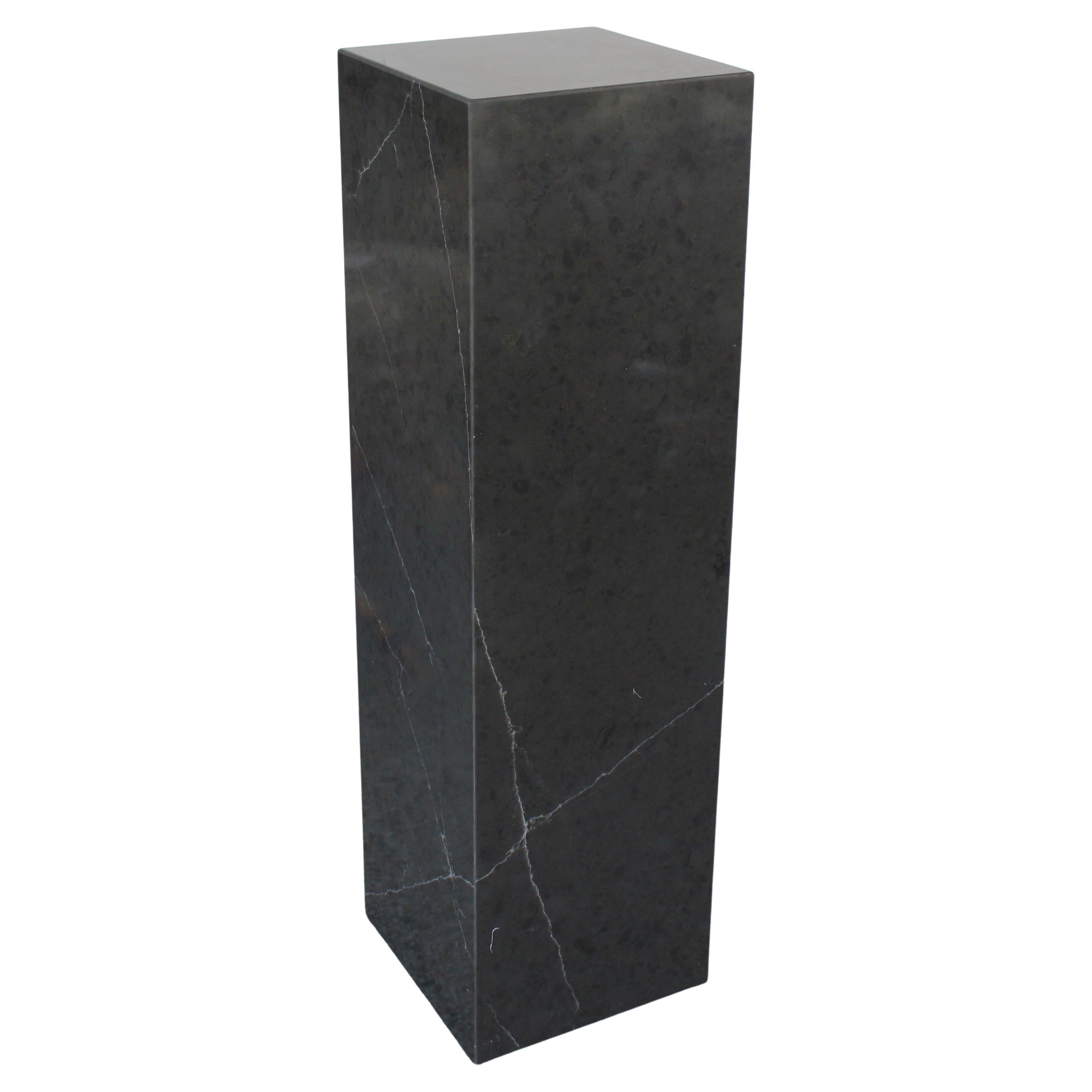 This stylish and chic varigated marlbe pedestal is a custom one-of-a-kind piece created by the Iconic Snob Galeries.

Note: The color is a mottled gray and when the light hits it can turn a dark gray/black.

Note: There are aluminum risers on