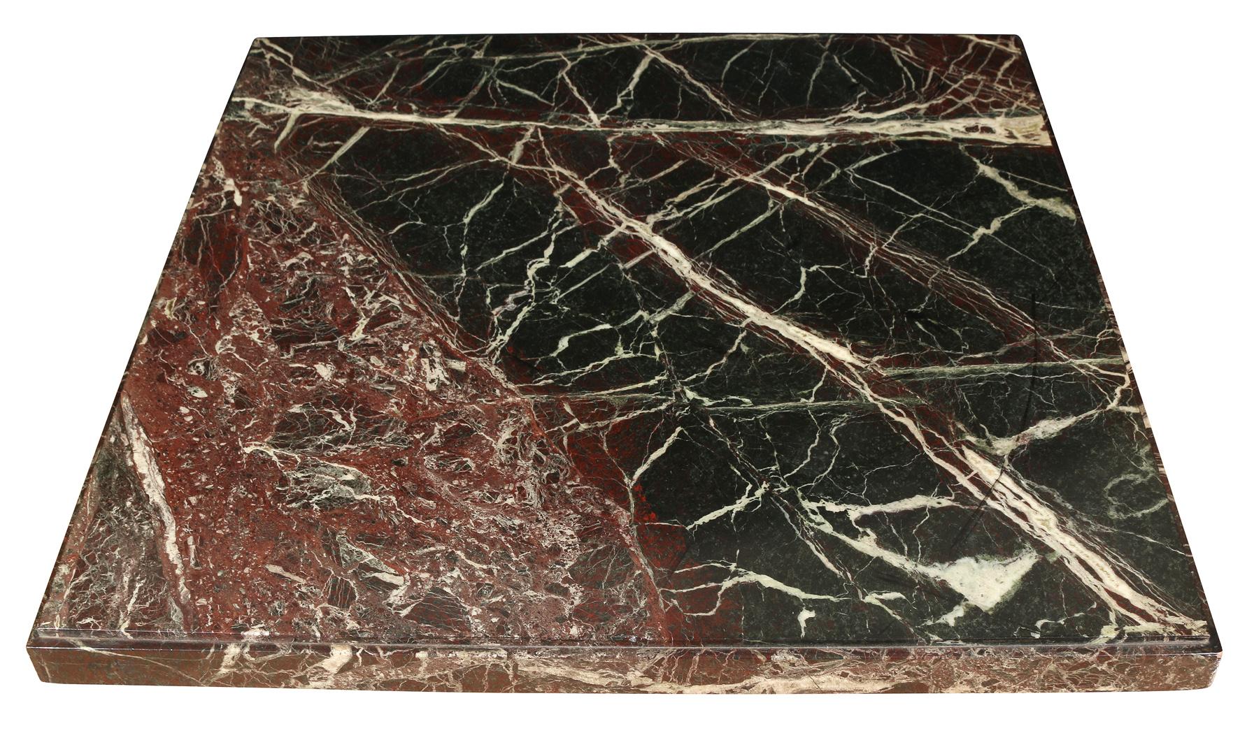 This sleek table consists of a pedestal base supporting a square solid marble top with a beveled edge.  The veining, in rich brown, black, and white make this a statement piece that can work well in traditional or contemporary space.  