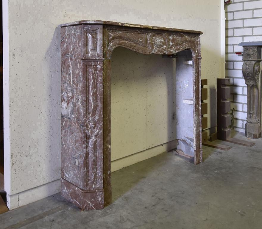 Marble Pompadour fireplace mantel from the 19th Century to
place in front of the chimney.
