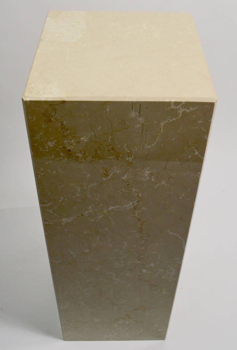 One marble pedestal (tall one in photo) in excellent original condition showing only a couple of inconsequential nicks at the bottom, normal and consistent with age. Perfect to display sculpture or important objects, or use as decorative elements as