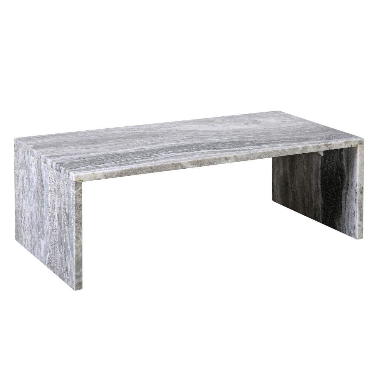 This marble coffee table seamlessly combines style and utility for contemporary homes through its sleek and simple design. Crafted from exquisitely polished natural light grey marble featuring smooth edges, this table is distinguished by its