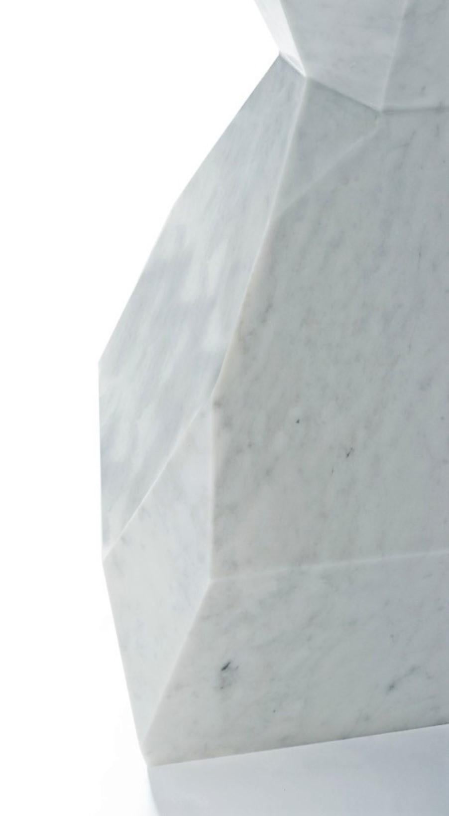 This minimalistic piece made from a single block of marble. The likeness of its faceted geometry can be found in nature in raw form.
Dimensions:
W 140 cm 55.1”
D 140 cm 55.1”
H 74 cm 29.1”
Materials as pictured:
White Carrara marble in honed