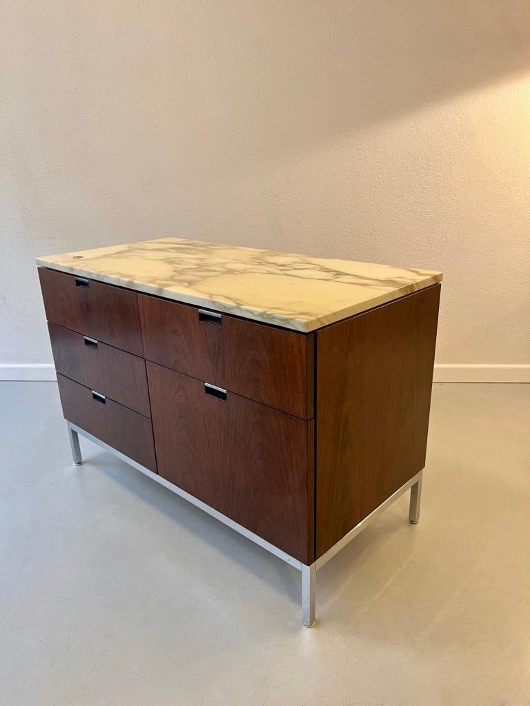 Marble and Rosewood Credenza or Sideboard by Florence Knoll produced by Knoll International ca. 1960
Very good condition. No keys for the moment.
5 drawers.
Adjustable steel glides.
