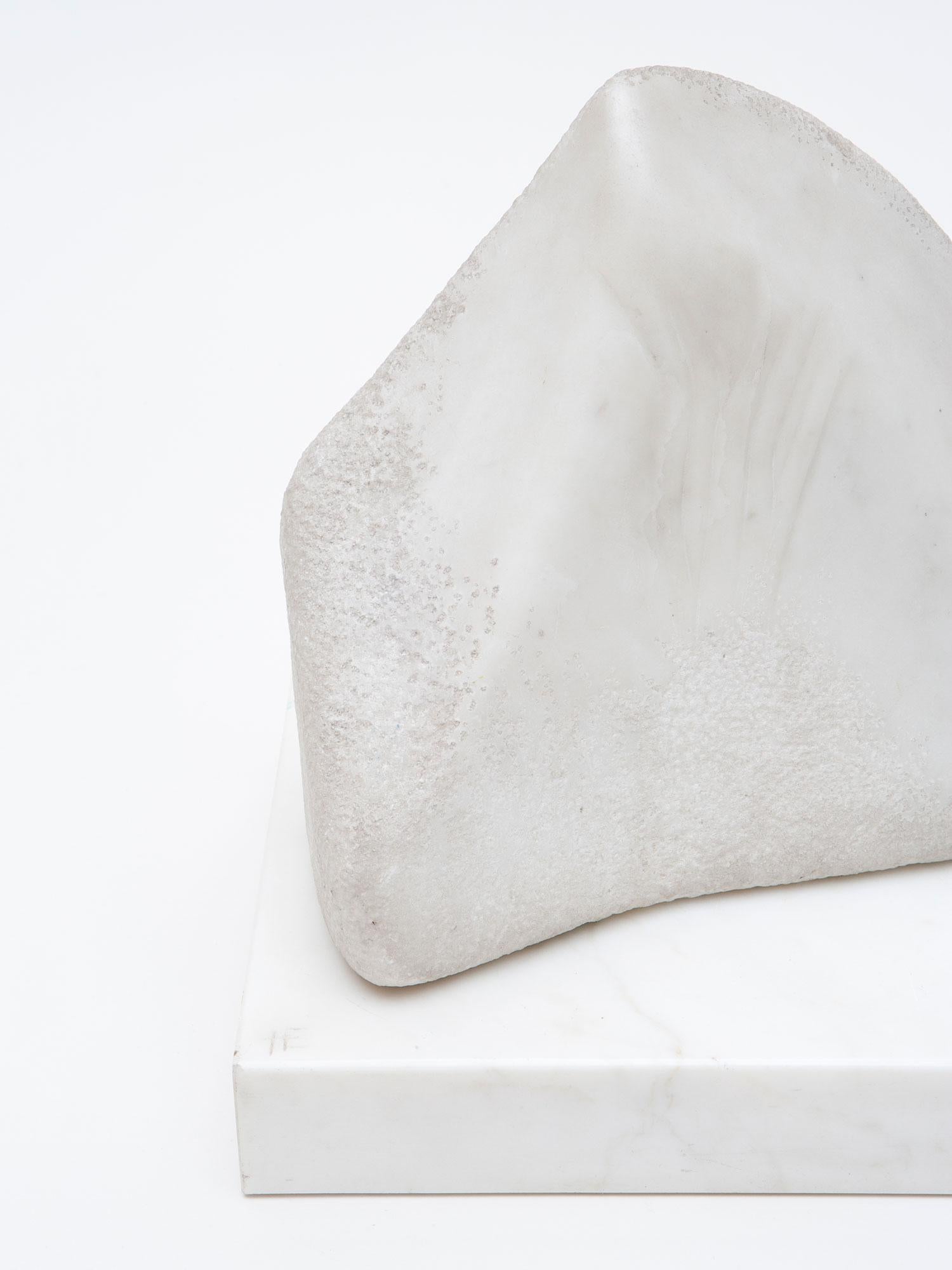 White Statuario Marble sculpture by Israeli-American artist Hanna Eshel (b. 1926). Hand carved in Carrara, Italy. Eshel is a multi-disciplinary artist best known for her work in carved marble, a skill she honed from 1972-1978 while living and