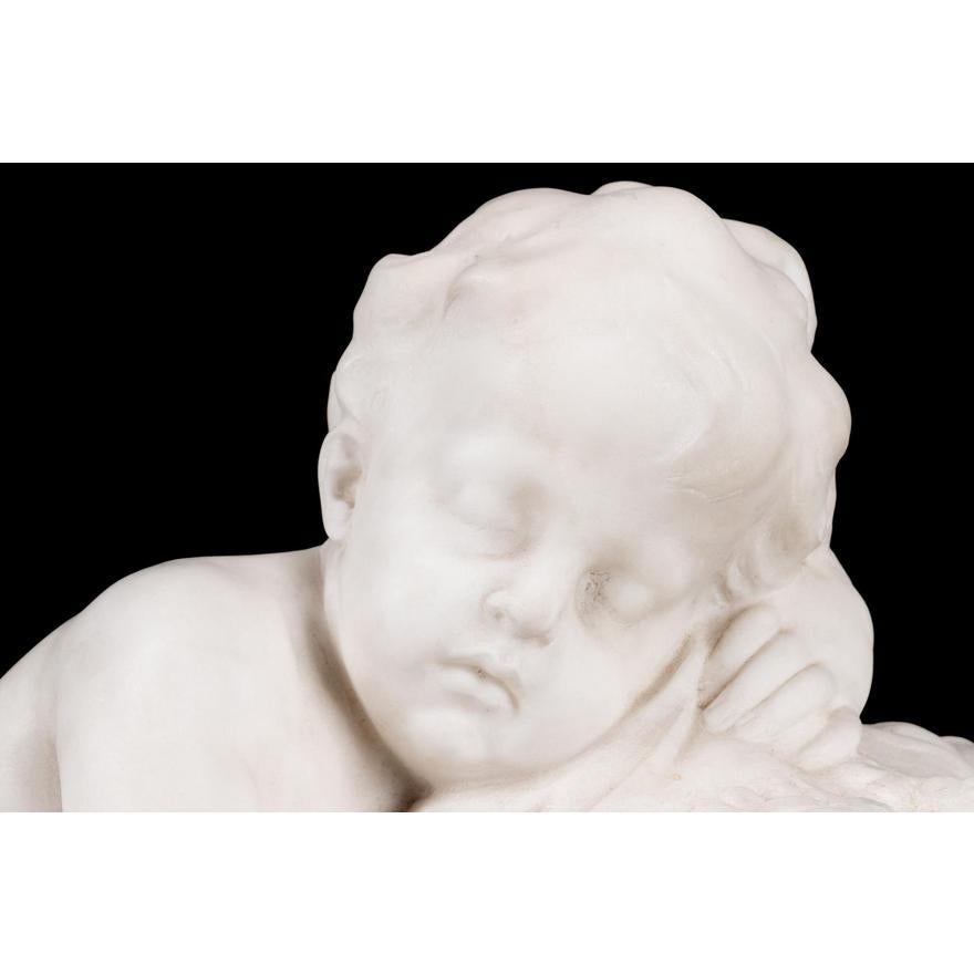 Italian School 'Cupid Sleeping on a Bed of Flowers', circa 1928, carved marble sculpture depicting a recumbent cupid holding arrows and a partial box, signed and dated to right lower base. Signature reads Prof. Castrucci - Piza - Volterra 1928.