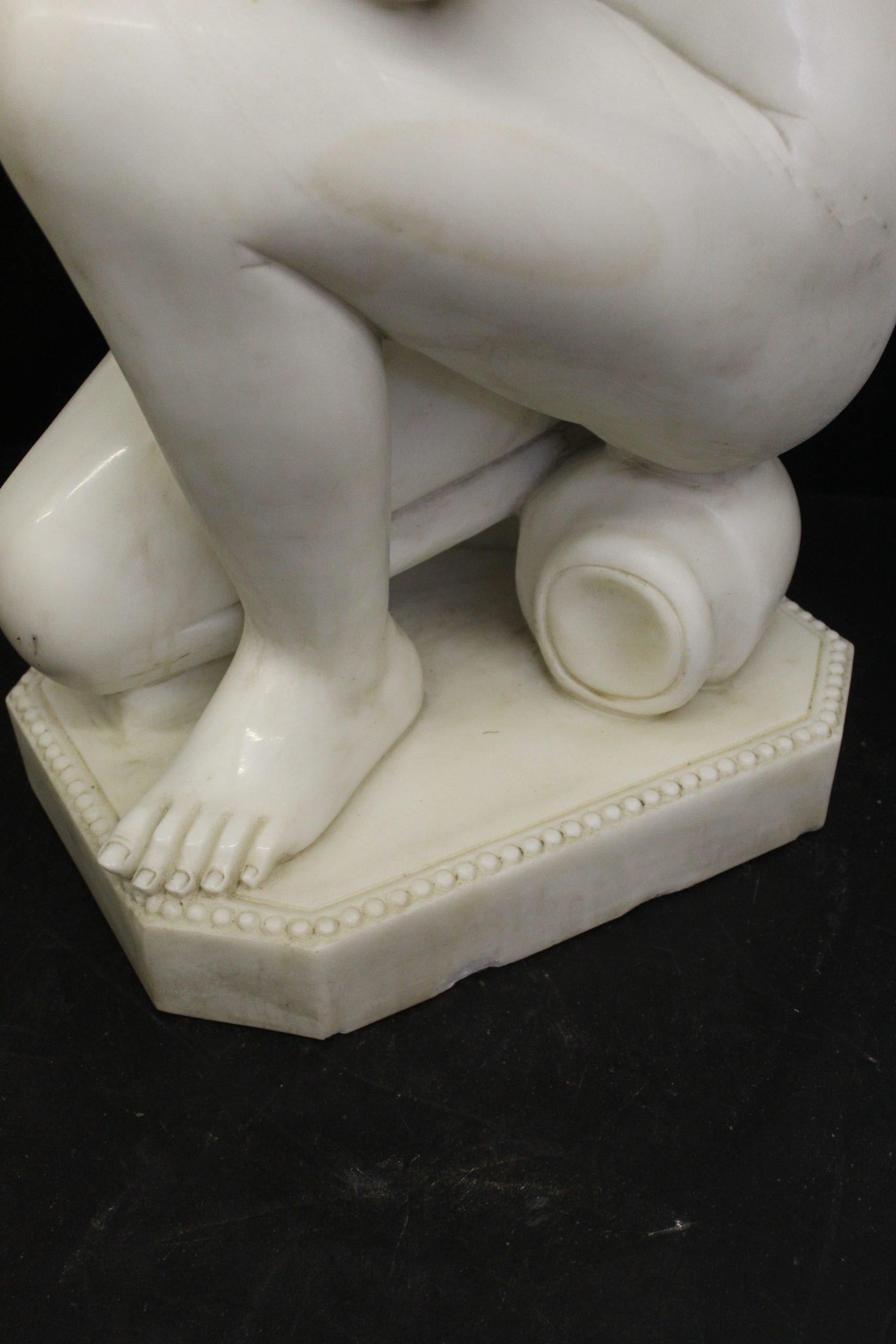 Italian Marble Sculpture. Depicting a Crouching Venus For Sale
