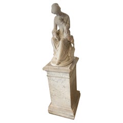 Marble sculpture of a woman and her dog