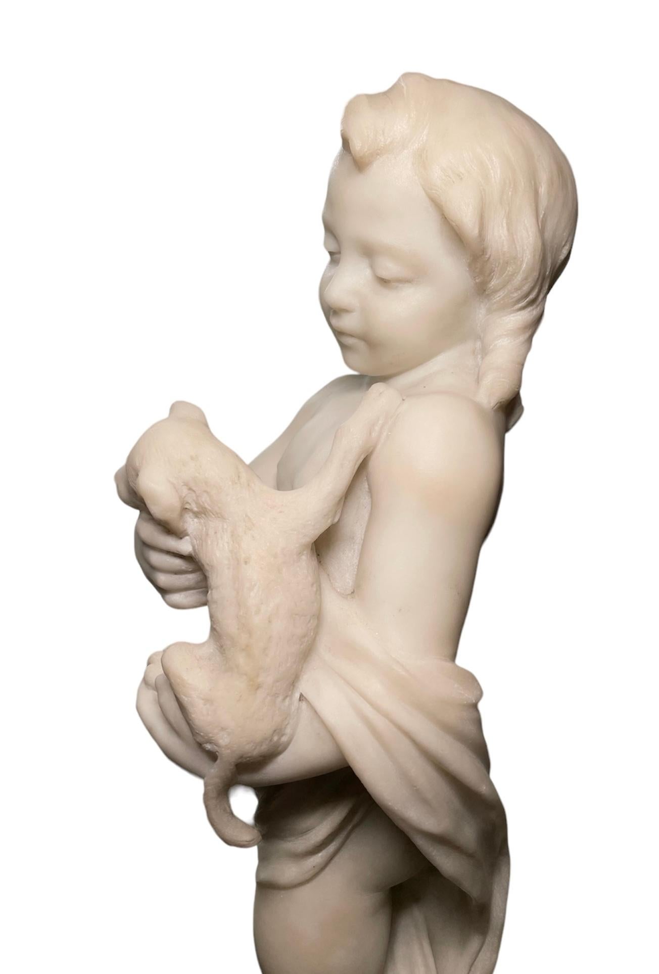 Carved Marble Sculpture Of Cherub Holding A Puppy  For Sale