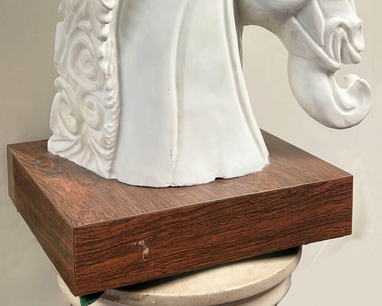 Stylized marble sculpture of a horse by the Italian sculptor, Amedeo Gennarelli (1881-1943), mounted on a wooden plinth with veneer.  