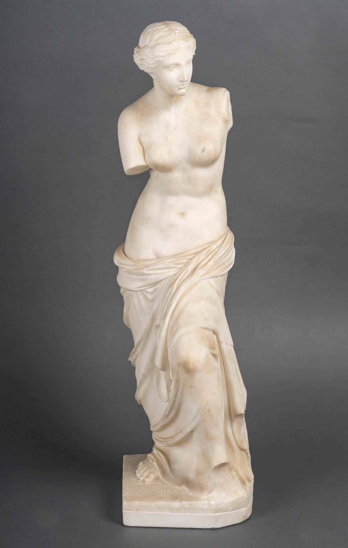 Marble sculpture representing the Venus de Milo, 20th century.

A 20th century white marble sculpture of the Venus de Milo.
H: 62cm, W: 17cm, D: 15cm