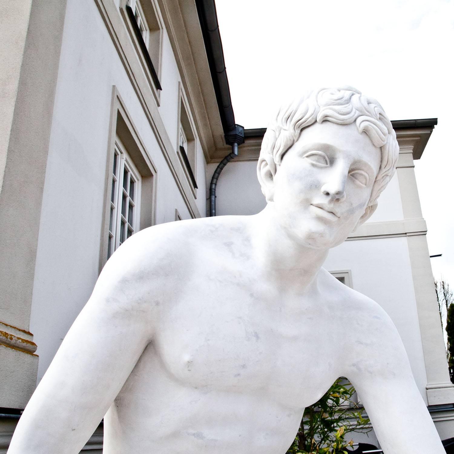 Life-sized marble sculpture of the so called ‘Resting Hermes’ by Lysippos. The sculpture was hand-carved out of white marble and has a fine surface.