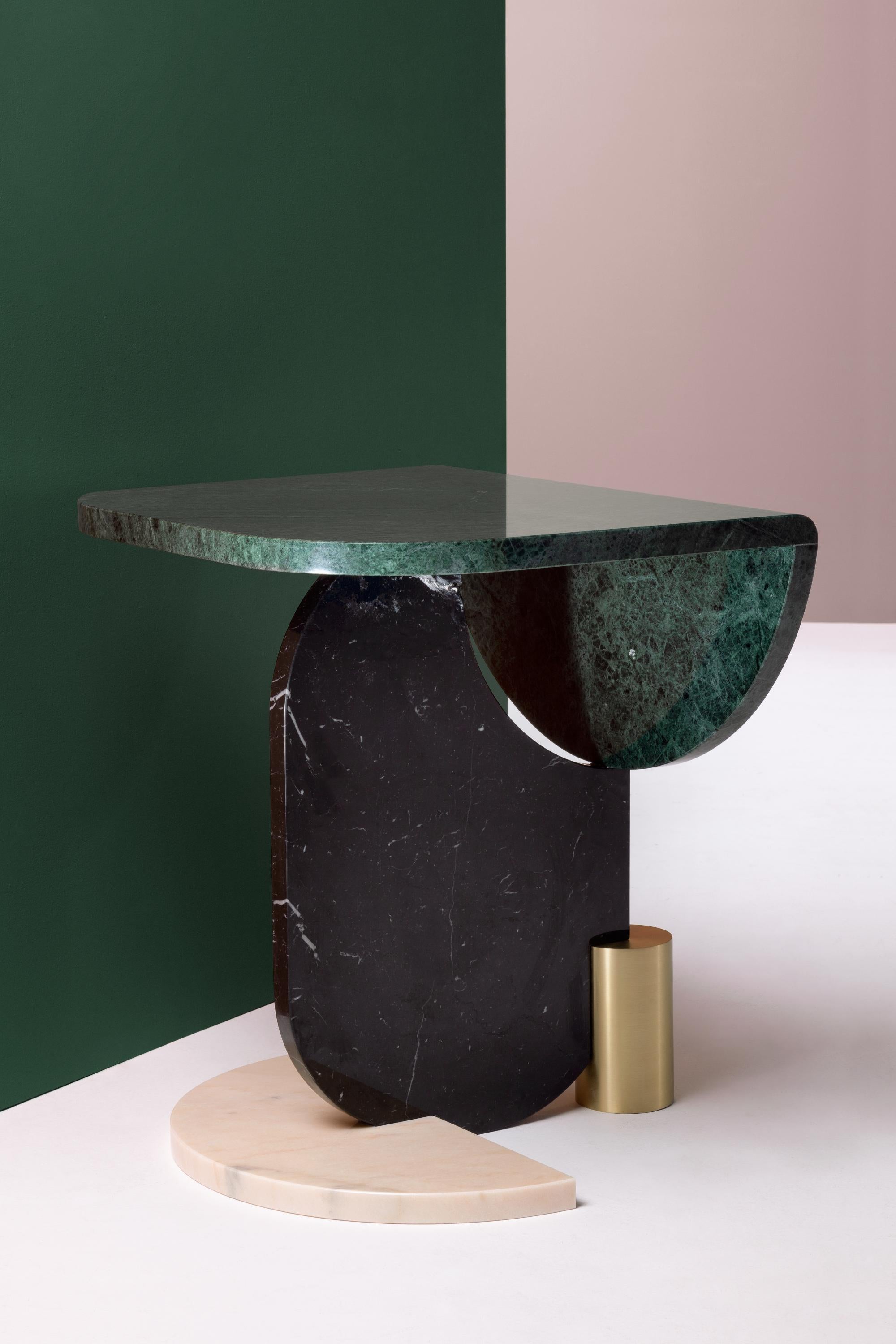 Marble side table by Dooq
Mwasures: W 52 cm 20”
D 60 cm 24”
H 61 cm 24”

Materials: top, oval and half-circle base marble:
guatemala green, estremoz white, estremoz
rose, Carrara, nero marquina, emperador
metal base polished/satin brass, copper