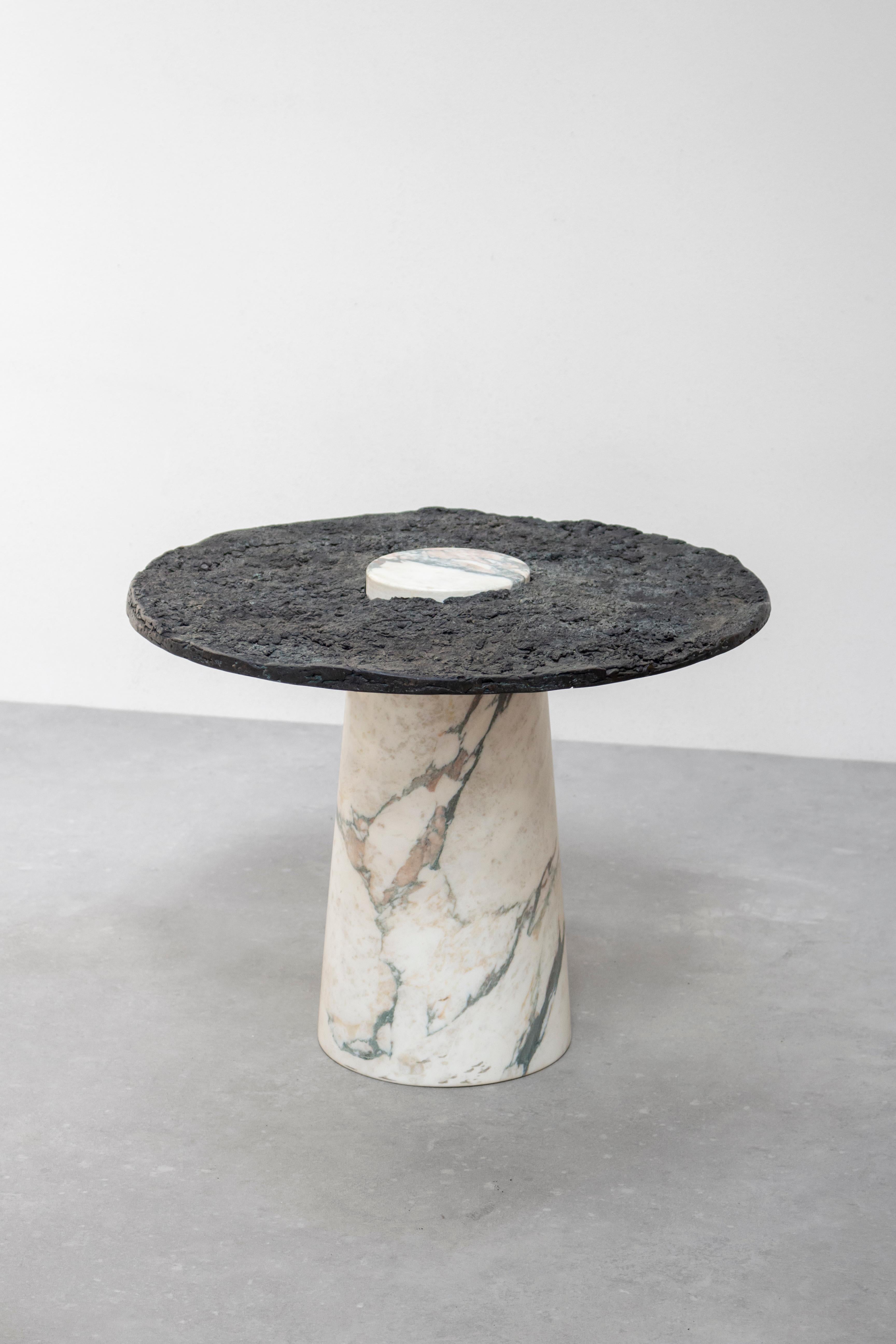 Marble side table by Tipstudio
Numbered Edition
Dimensions: Ø 50 x 45 cm
Materials: Calacatta Marble, Bronze Top
Weight: 50 kg 

Tipstudio, Imma Matera and Tommaso Lucarini, has chosen to focus on metals byproduct aims to enhancing them by