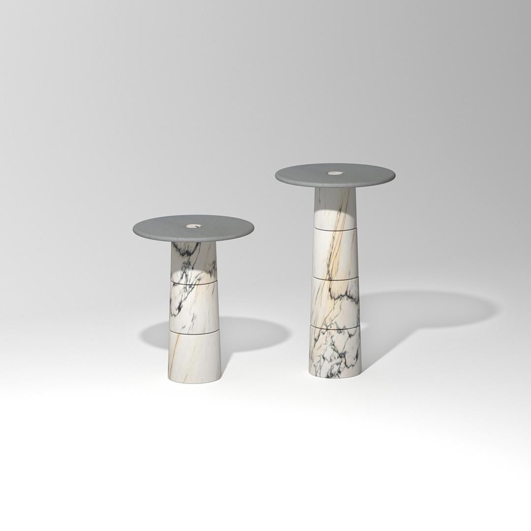 Marble side table set by Samuele Brianza.
Dimensions: 
45 x 45 x 57 cm.
45 x 45 x 75 cm.
Materials: 
- paonazzo marble 16 blocks.
- sarnico stone round top.

Primo is a modular system made of load-bearing marble elements and shelves that fit