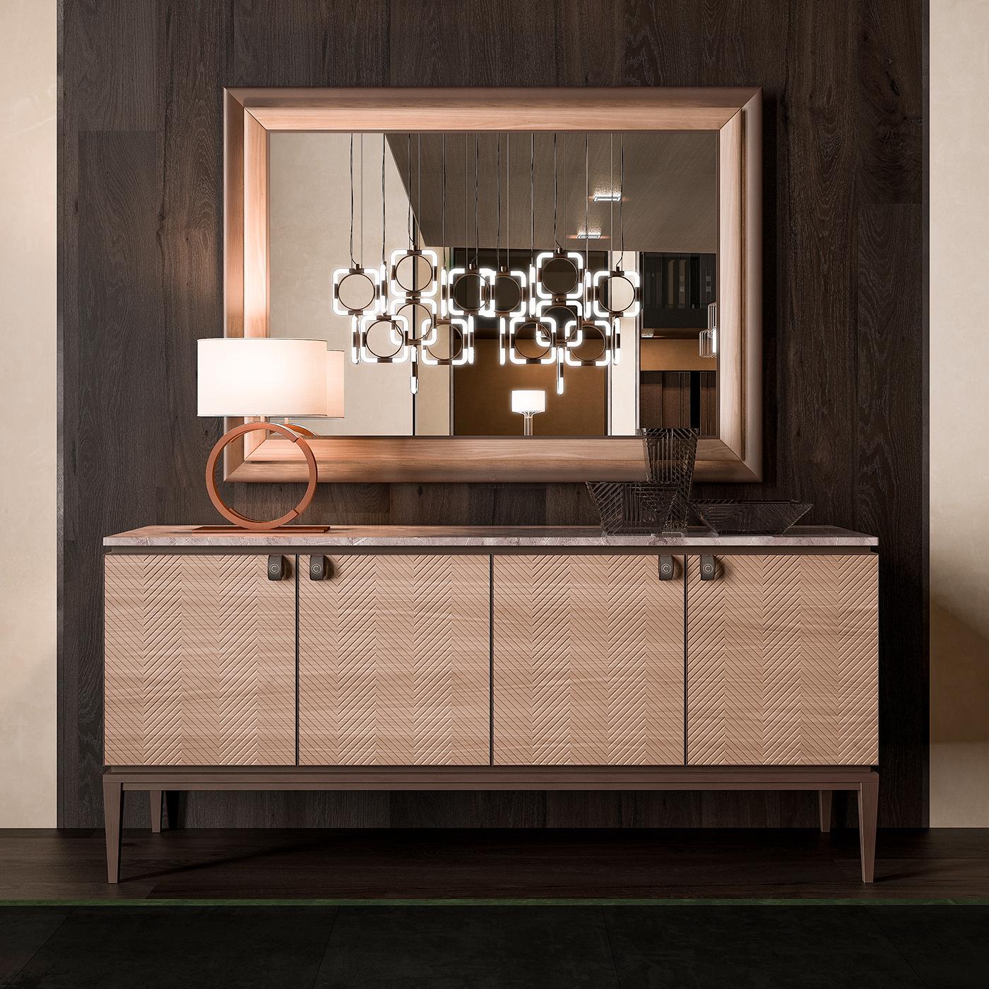 From a boutique collection of living and dining room furnishings, the marble sideboard with engraved veneer is characterized by its engraved zig-zag cabinet fronts. Topped in chic marble, the sideboard manages a minimalist feel thanks to its