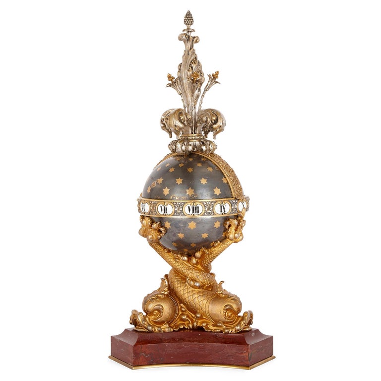 Marble, silvered bronze, and ormolu clock set by Barbedienne
French, late 19th century
Measures: Clock: Height 59cm, width 26cm, depth 26cm
Candelabra: Height 53cm, width 22cm, depth 22cm

This unusual clock set, by the famed fondeur