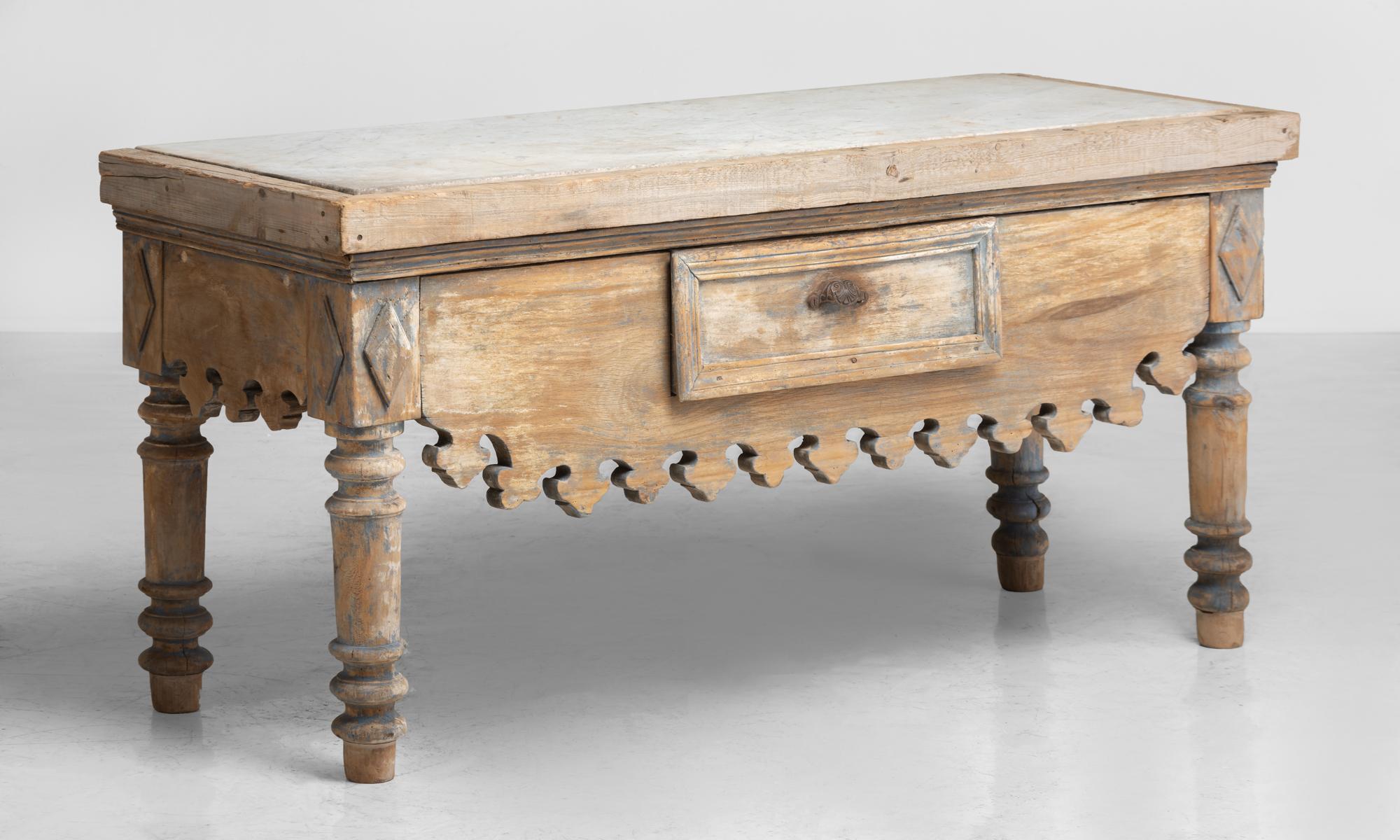 Marble slab butchers table, France, circa 1900

Unique form includes a single drawer, with distressed patina, original paint and inset marble top.