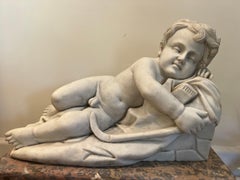 Marble sleeping Cupid Statue in the style of François Duquesnoy