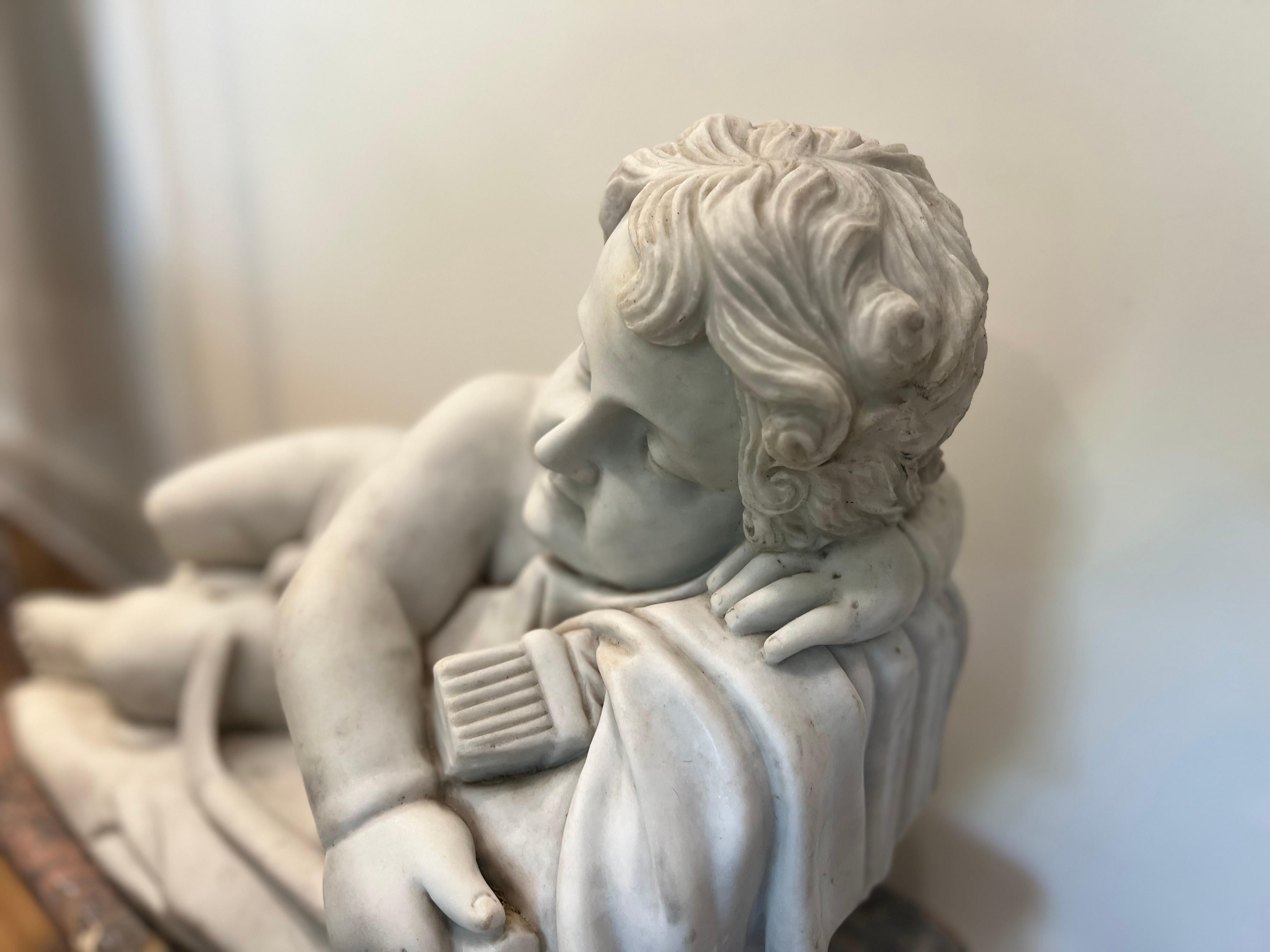 Italian Marble sleeping Cupid Statue in the style of François Duquesnoy For Sale