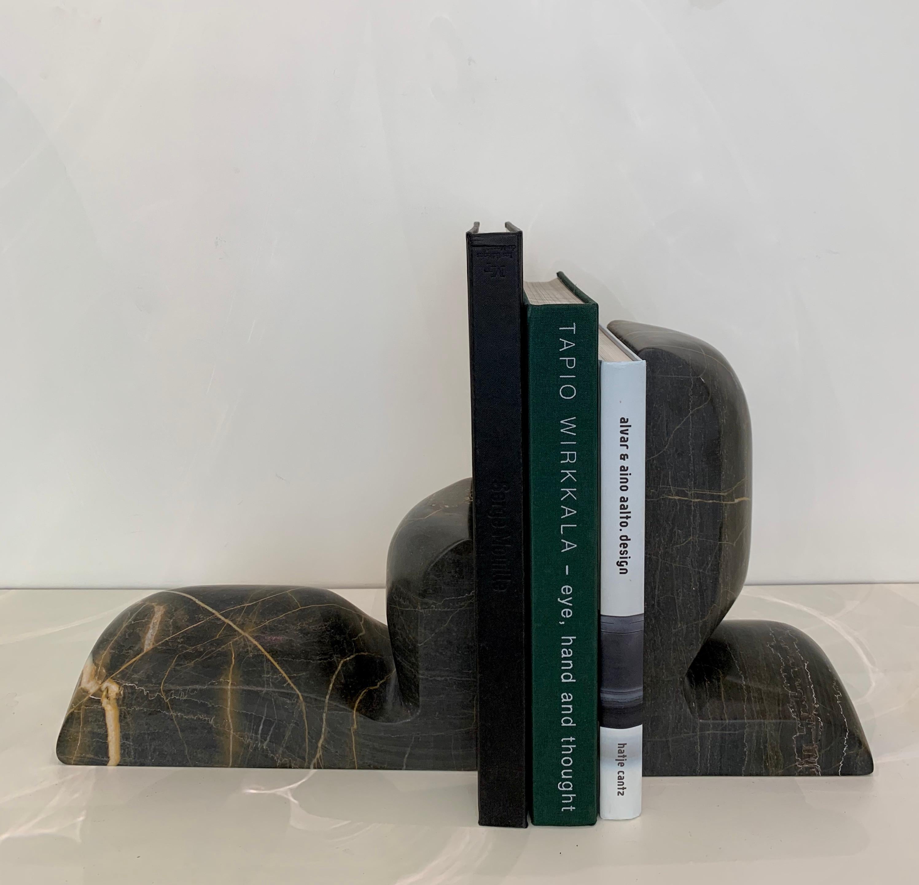 Pair of 'SLO' book ends in 'Grey Sain Laurent' marble by French designer Christophe Delcourt. 
Renown designer and interior decorator Delcourt celebrates his passion for noble materials, by infusing the pristine marble with the appearance of a soft