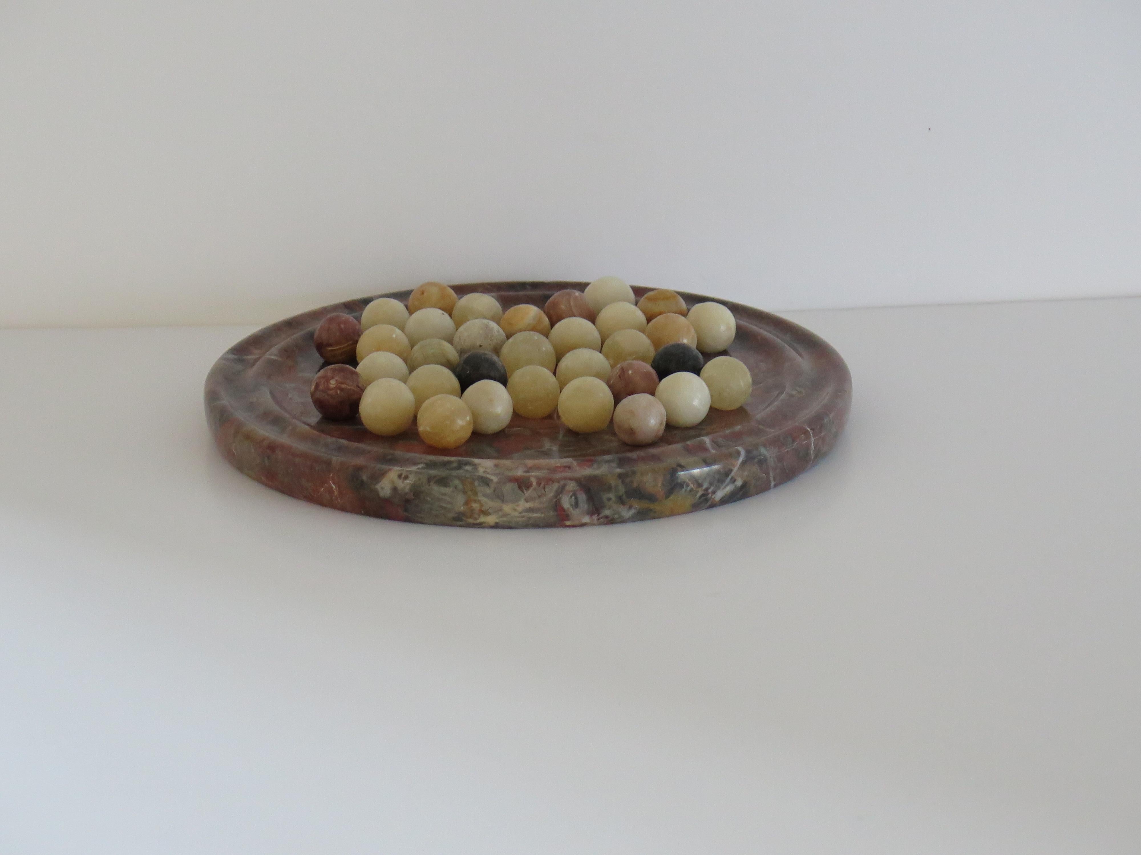 Ceramic Marble Solitaire Board Game Natural Stone Board & 33 Agate Marbles, circa 1930s