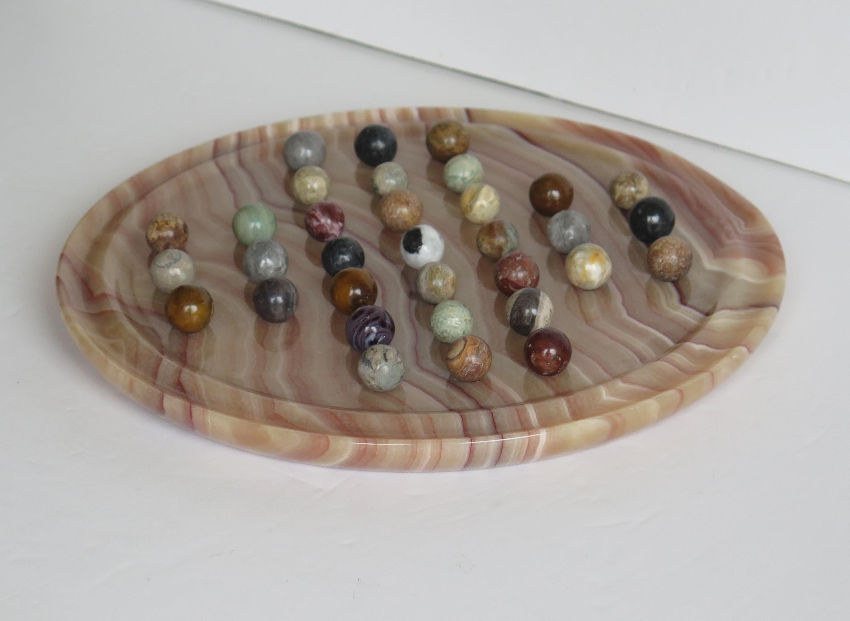20th Century Marble Solitaire Board Game Natural Stone Board & 33 Agate Marbles, circa 1950