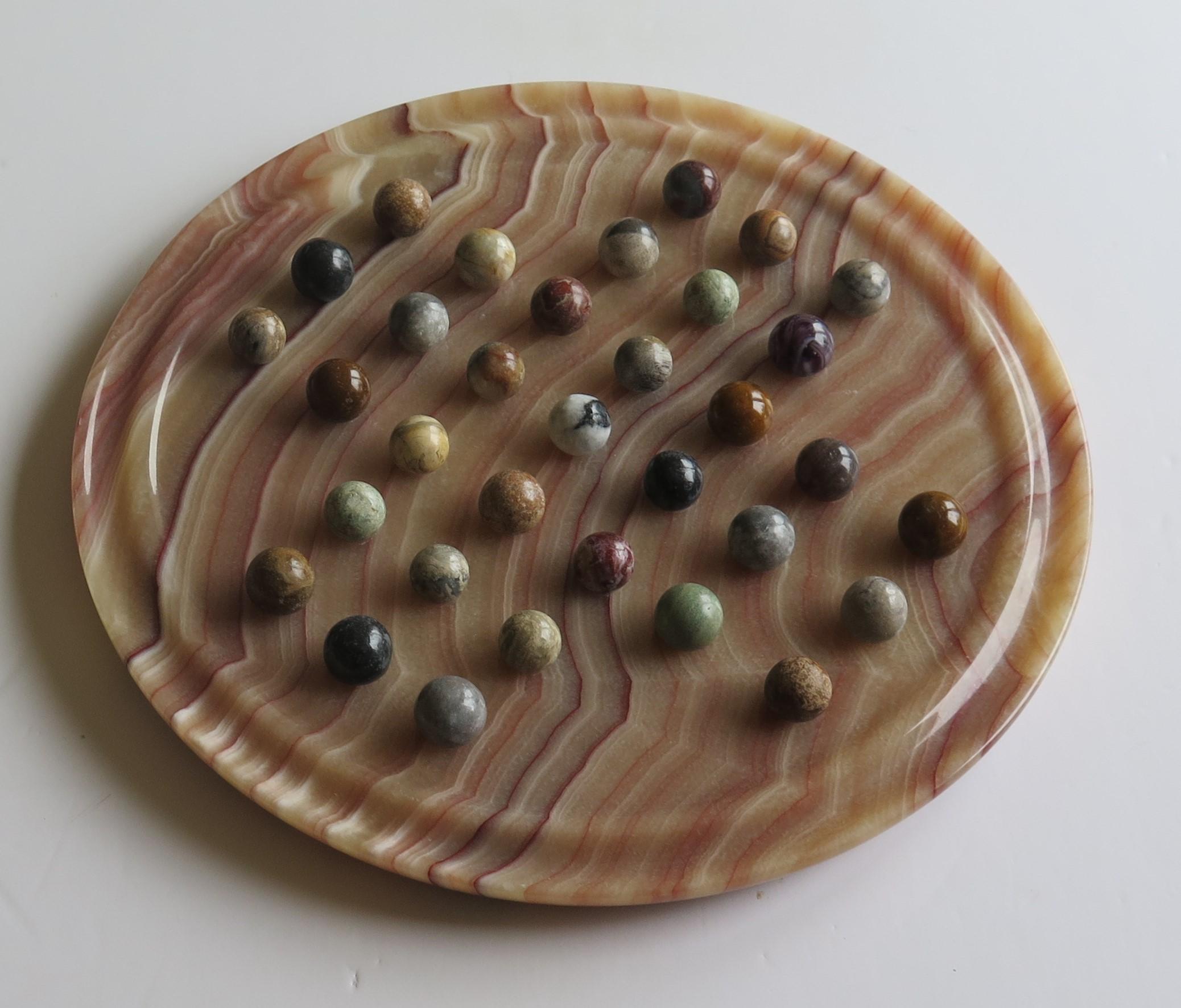 Ceramic Marble Solitaire Board Game Natural Stone Board & 33 Agate Marbles, circa 1950