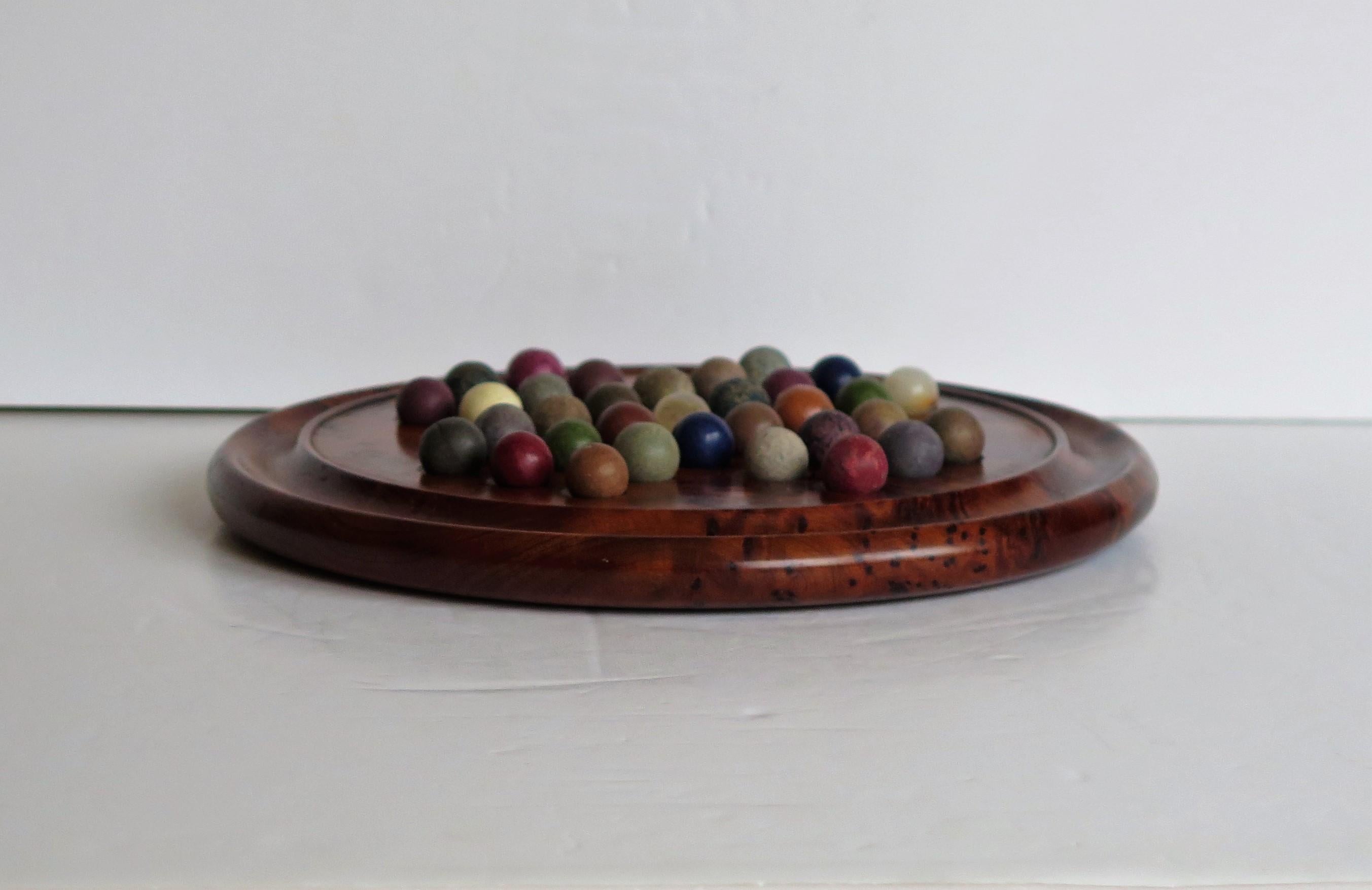 Hand-Crafted Marble Solitaire Board Game with 33 Early Handmade Stone Marbles, circa 1900