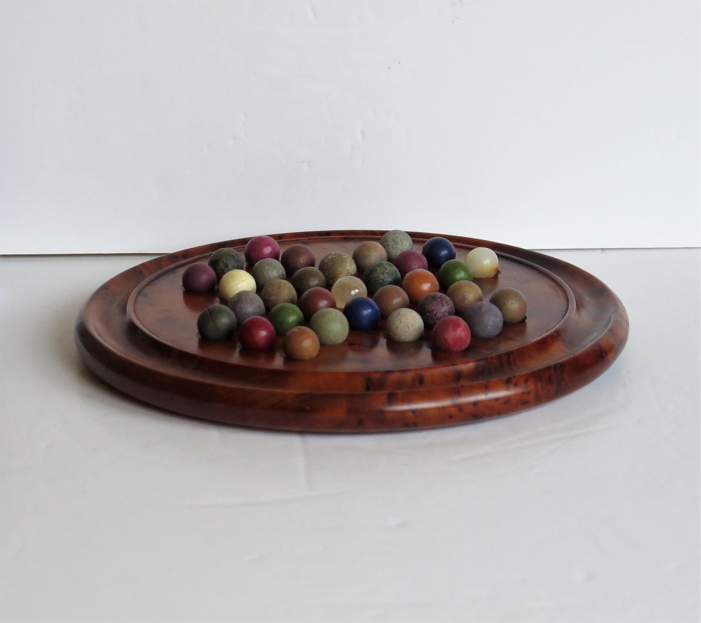 Marble Solitaire Board Game with 33 Early Handmade Stone Marbles, circa 1900 In Good Condition In Lincoln, Lincolnshire
