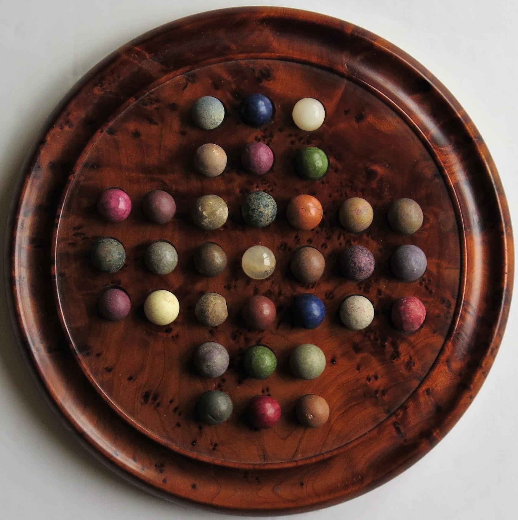 19th Century Marble Solitaire Board Game with 33 Early Handmade Stone Marbles, circa 1900