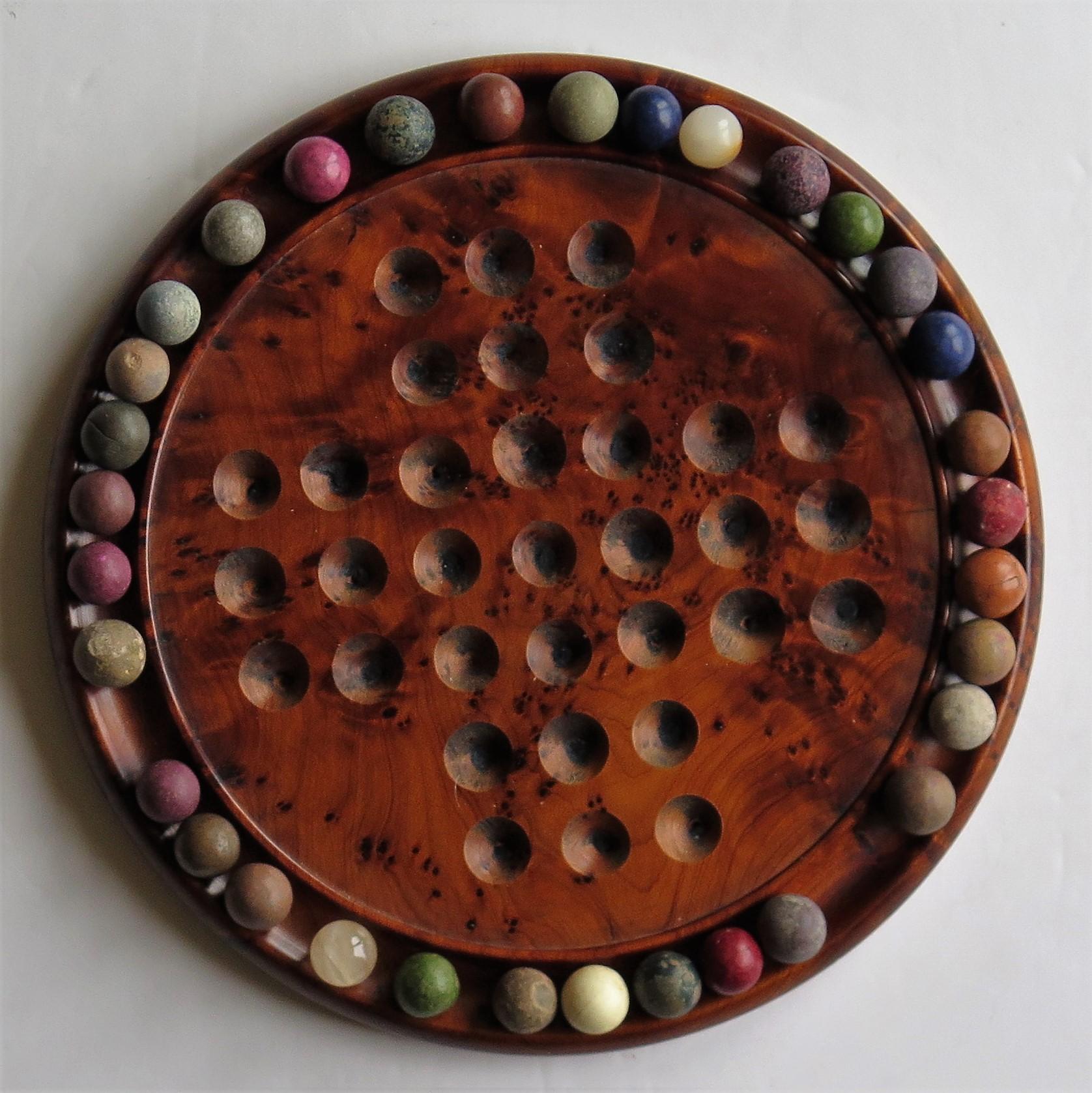 Marble Solitaire Board Game with 33 Early Handmade Stone Marbles, circa 1900 1