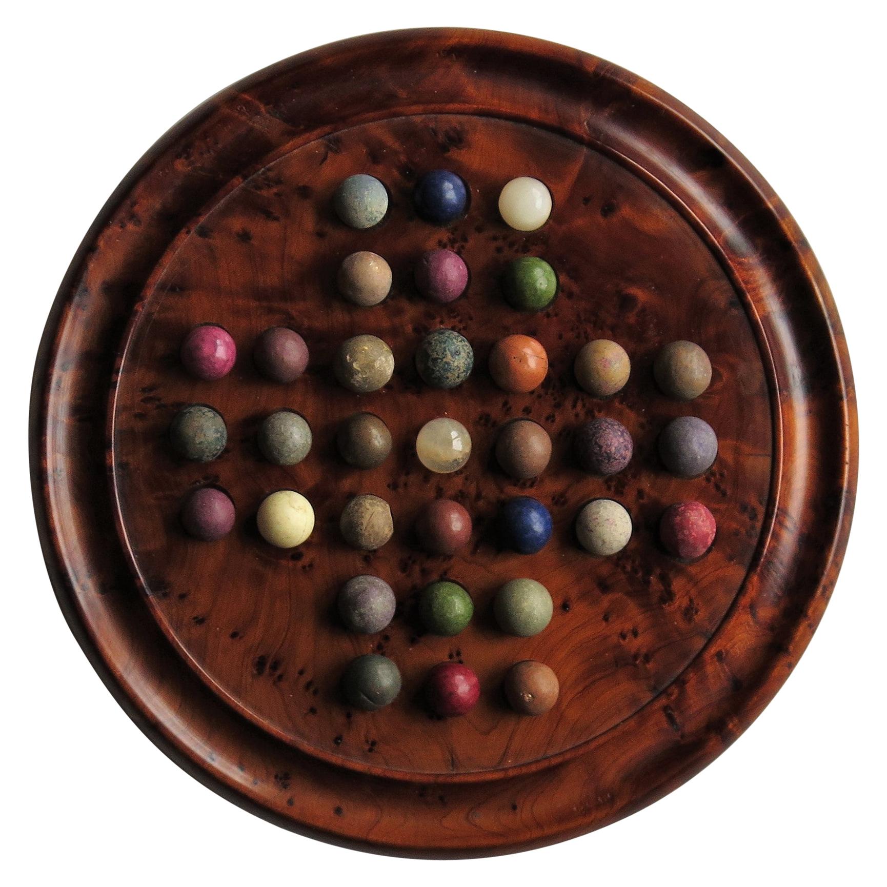 Marble Solitaire Board Game with 33 Early Handmade Stone Marbles, circa 1900
