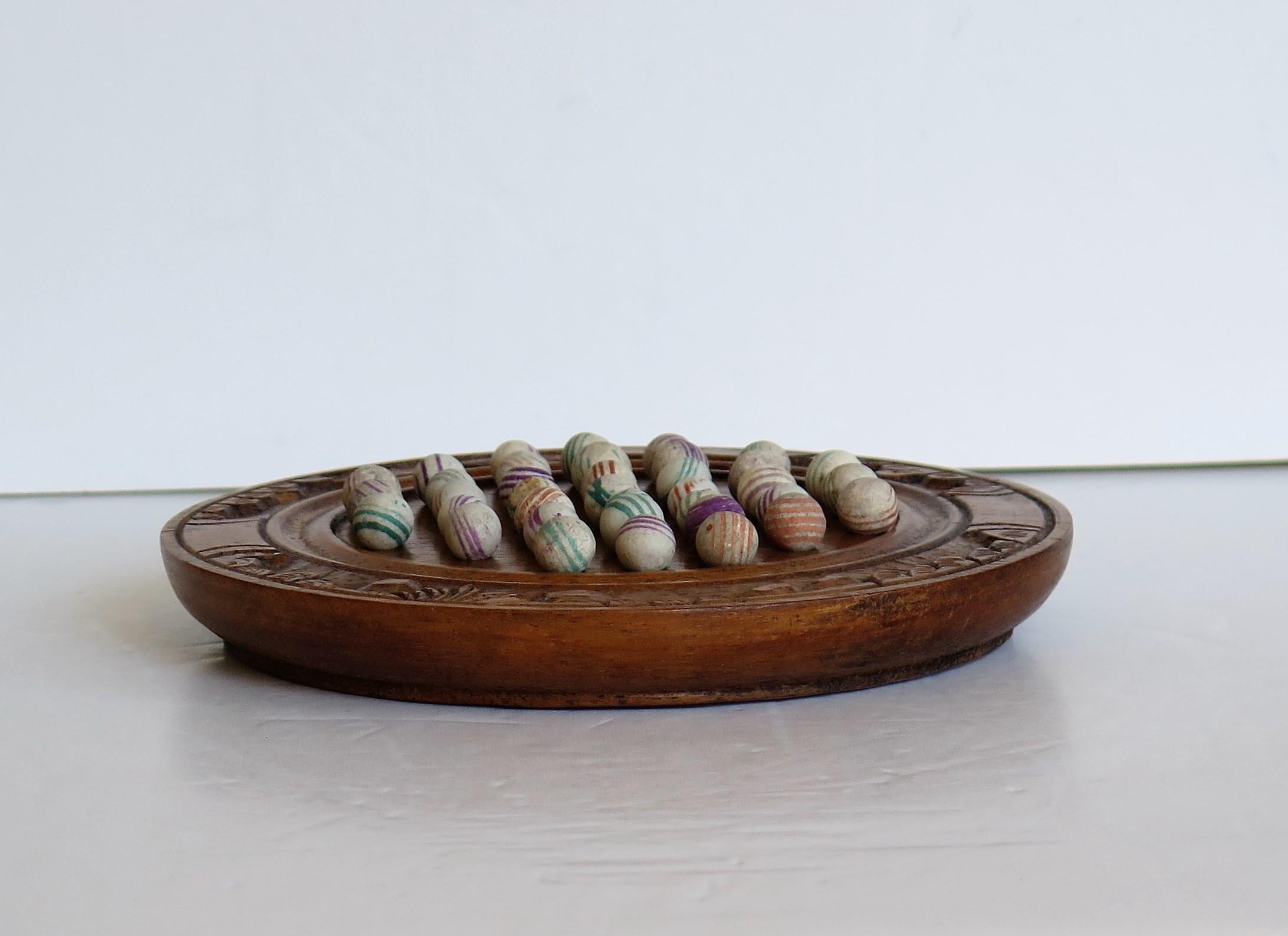 German Marble Solitaire Board Game with 37 Early Handmade Ceramic Marbles, circa 1870