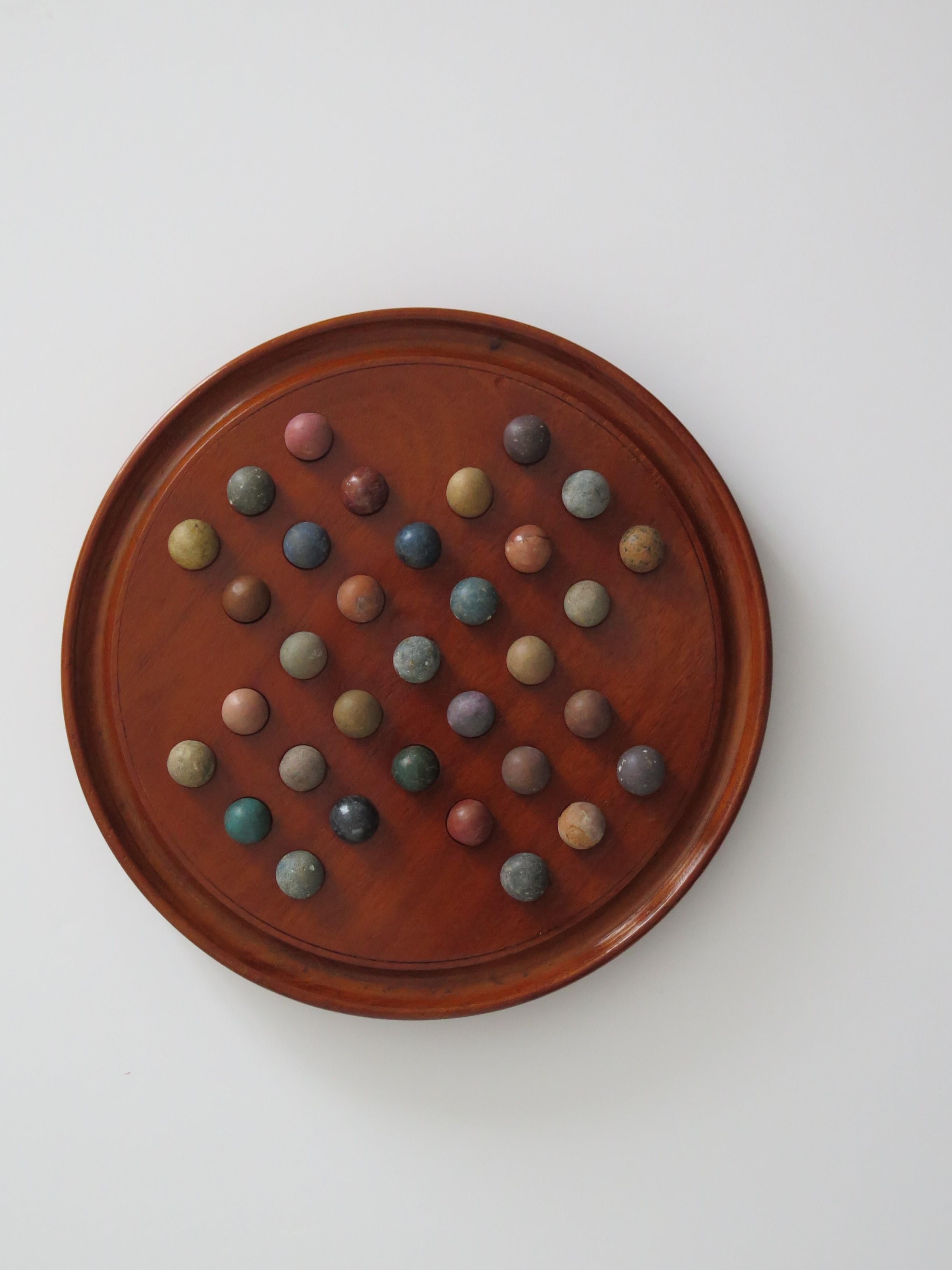 English Marble Solitaire Fine Hardwood Board with 33 Clay and Stone Marbles, Late 19th C