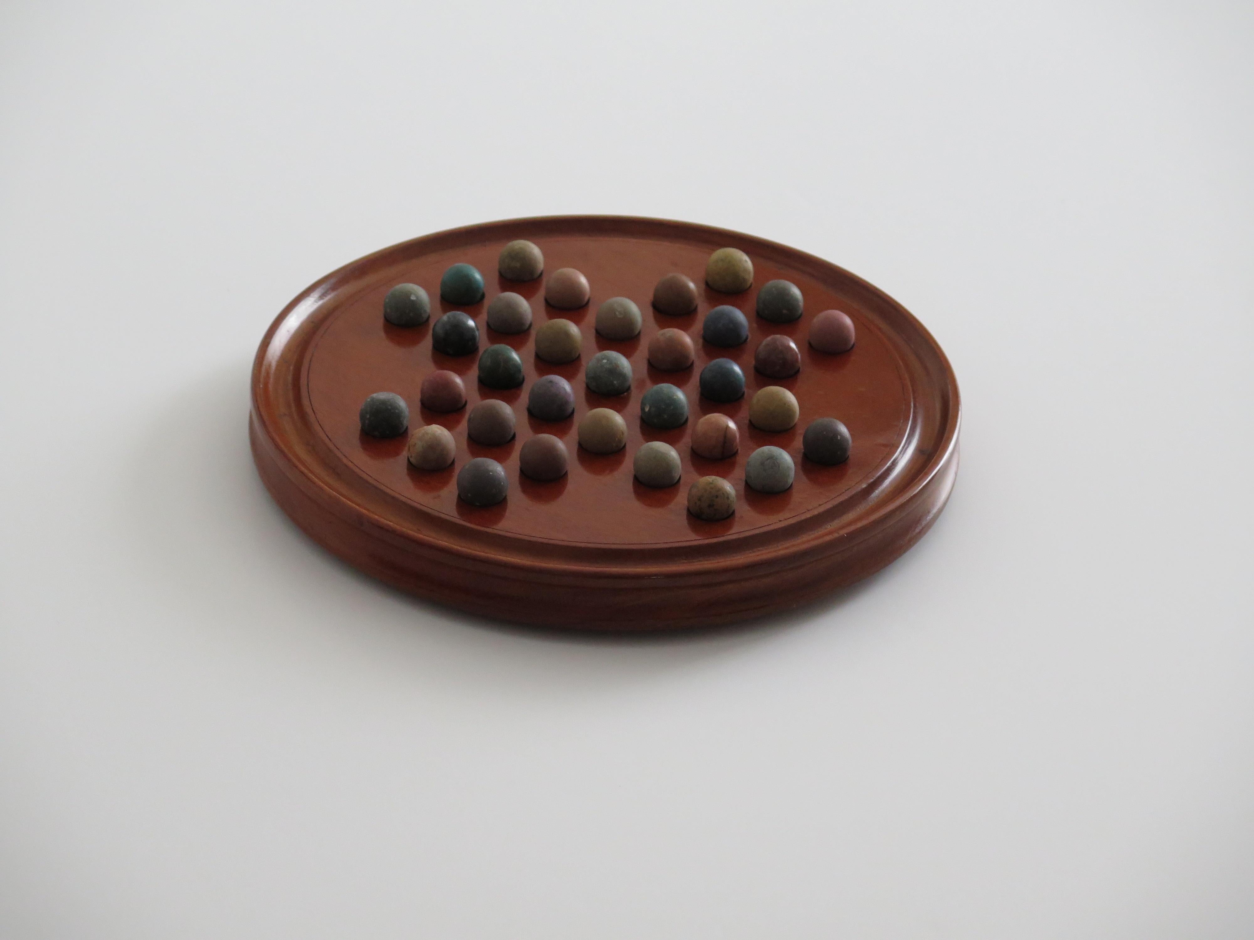 Marble Solitaire Fine Hardwood Board with 33 Clay and Stone Marbles, Late 19th C In Good Condition In Lincoln, Lincolnshire