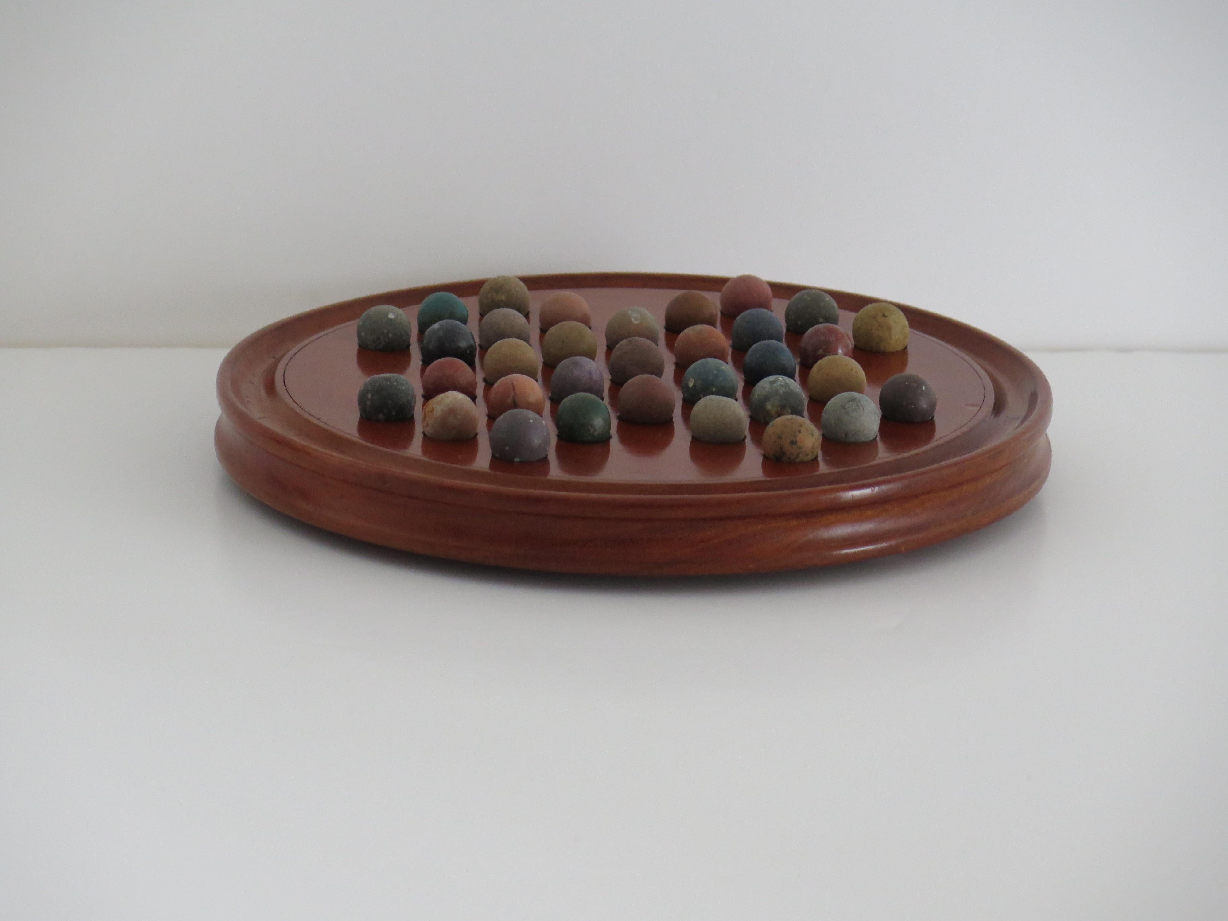 19th Century Marble Solitaire Fine Hardwood Board with 33 Clay and Stone Marbles, Late 19th C