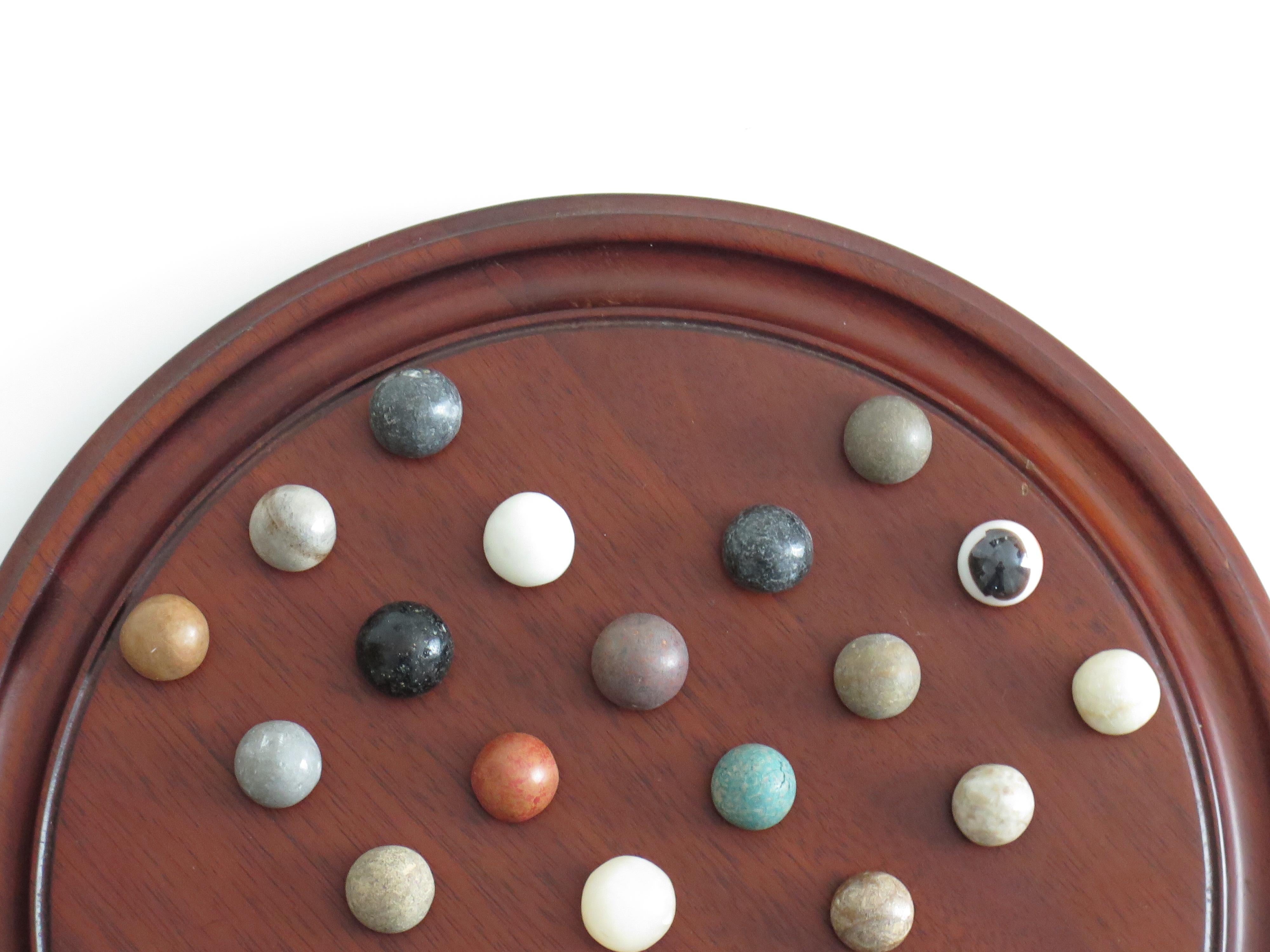 Marble Solitaire Game 10 inch Hardwood Board 35 mixed Stone Marbles, circa 1945 For Sale 1