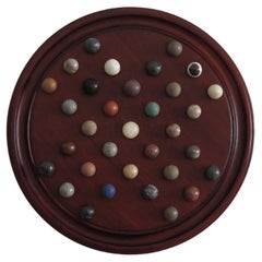 Marble Solitaire Game 10 inch Hardwood Board 35 mixed Stone Marbles, circa 1945