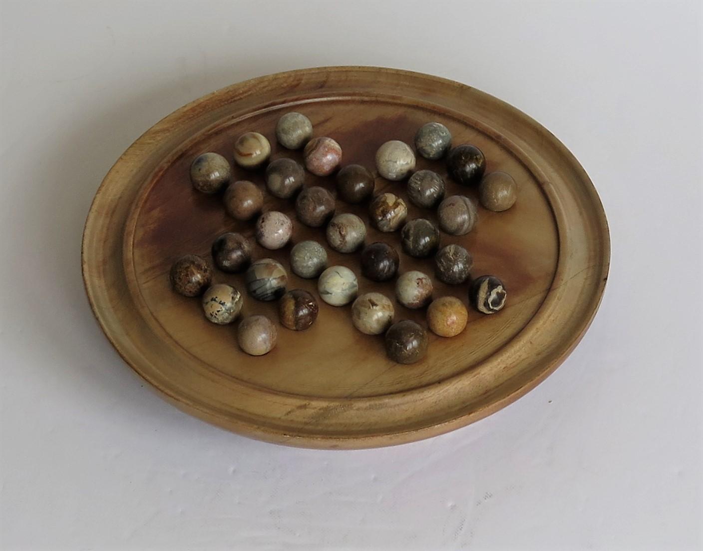 Hand-Crafted Marble Solitaire Game Hardwood Board 33 Agate Mineral Stone Marbles, circa 1920