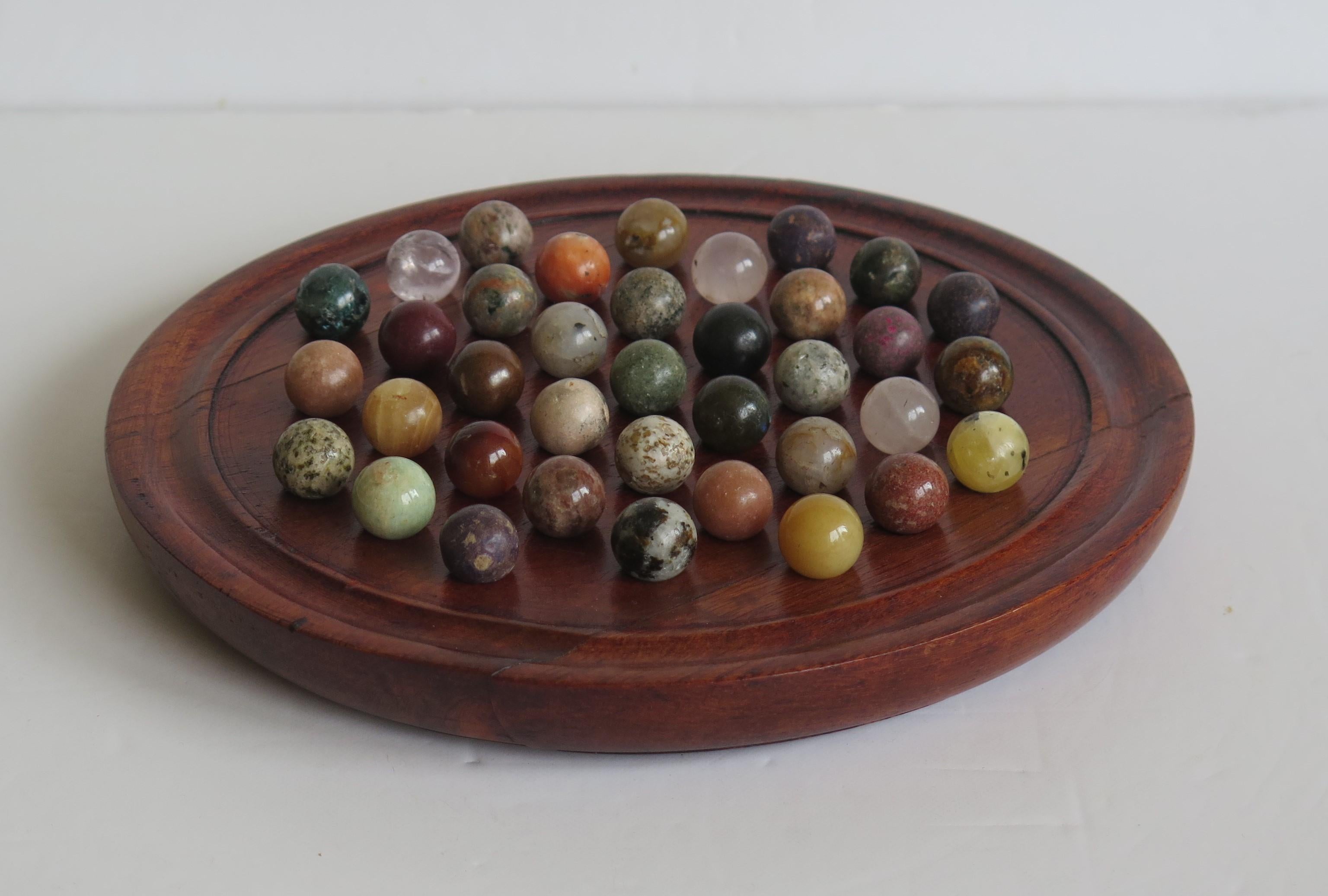 Folk Art Marble Solitaire Game Hardwood Board 37 Agate Mineral Stone Marbles, circa 1915