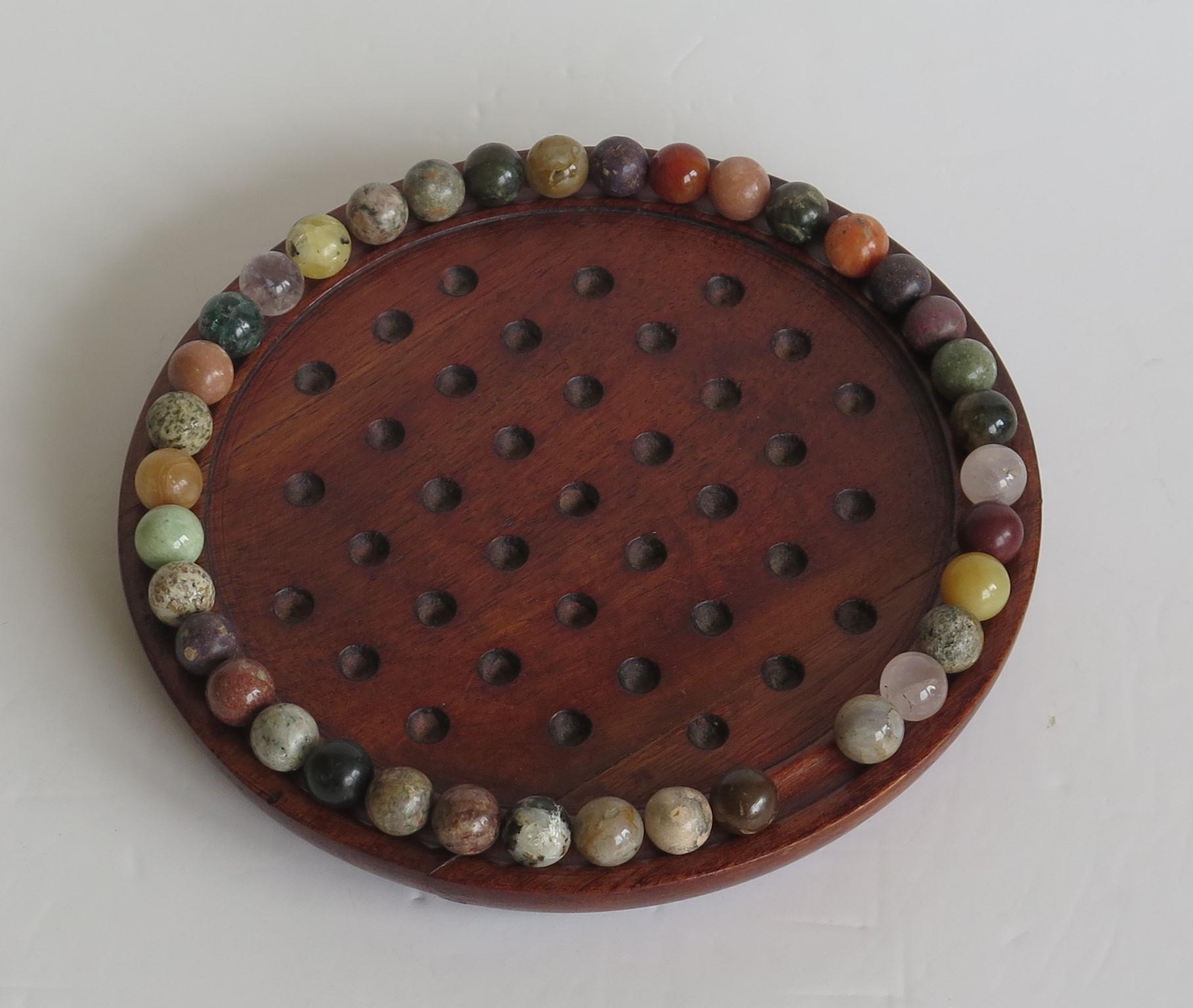 20th Century Marble Solitaire Game Hardwood Board 37 Agate Mineral Stone Marbles, circa 1915
