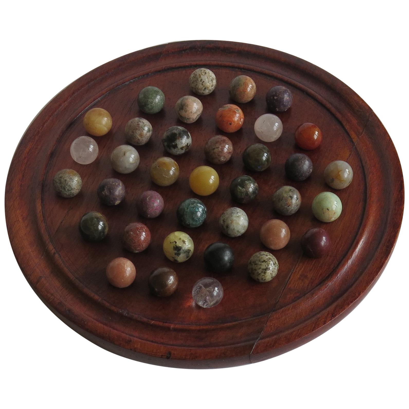 Marble Solitaire Game Hardwood Board 37 Agate Mineral Stone Marbles, circa 1915