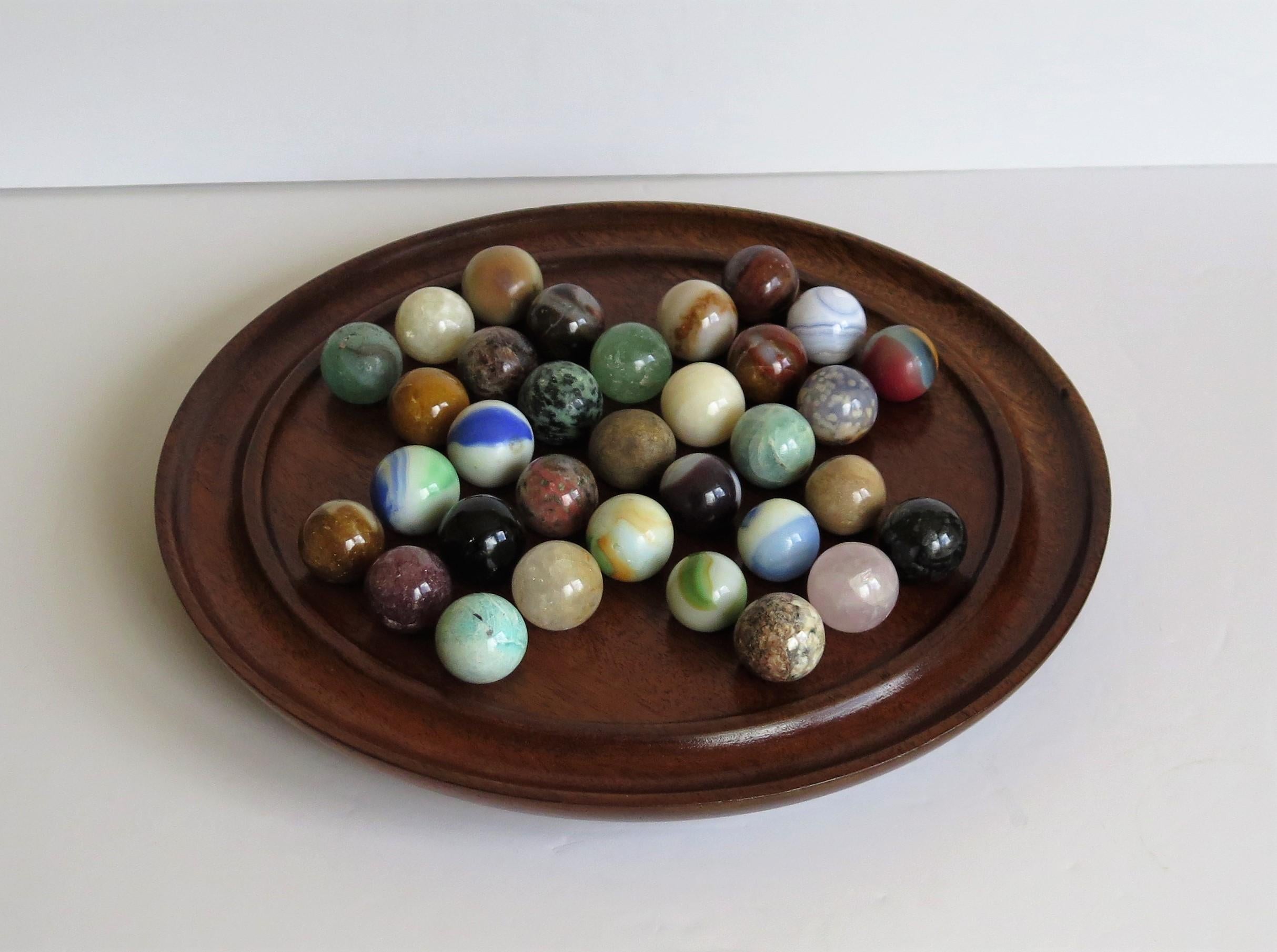 20th Century Marble Solitaire Game Hardwood Board and 33 Mainly Agate Mineral Stone Marbles