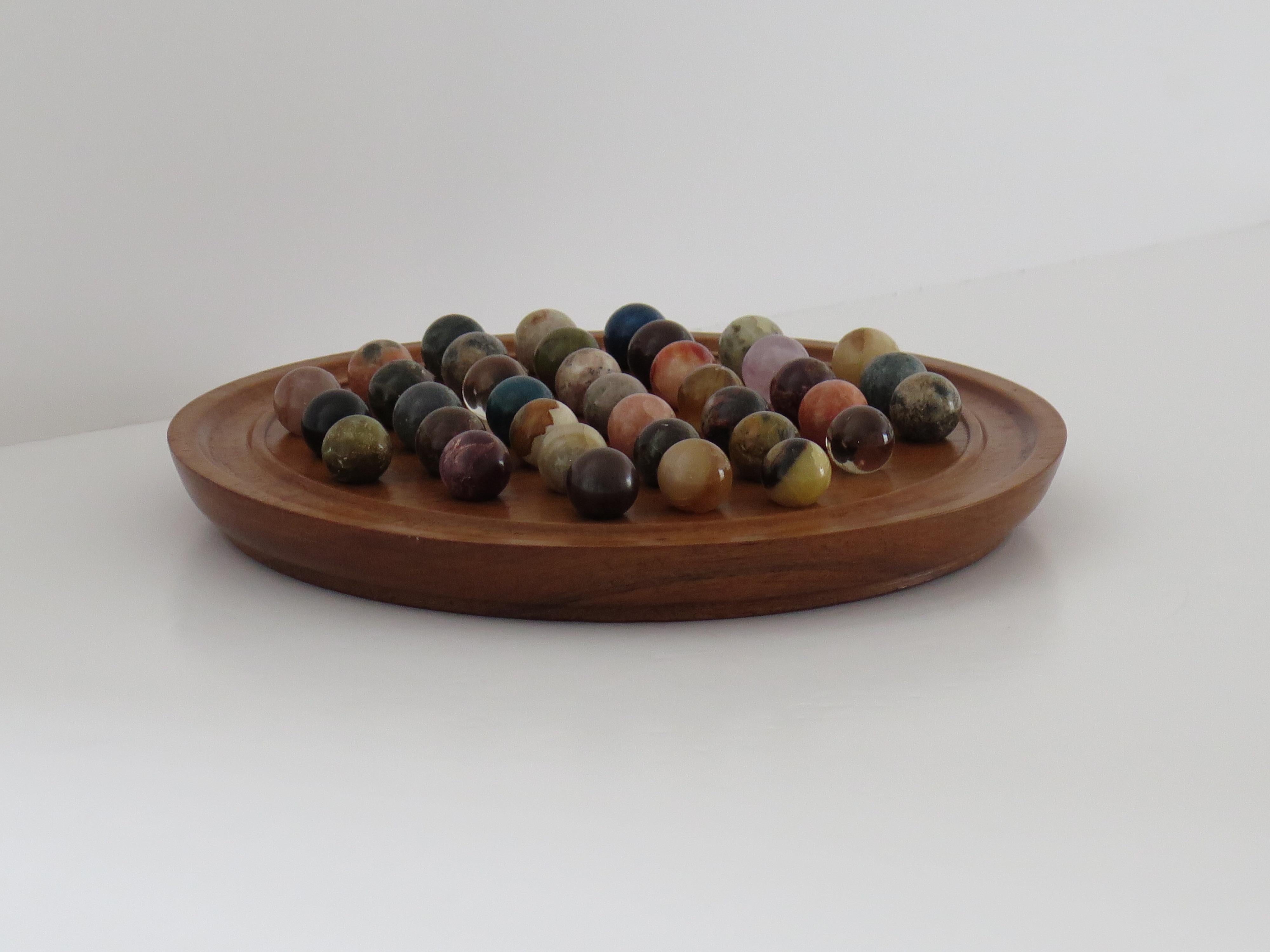 Marble Solitaire Game Hardwood Board with 38 Mineral Stone Marbles, French 1920s In Good Condition In Lincoln, Lincolnshire