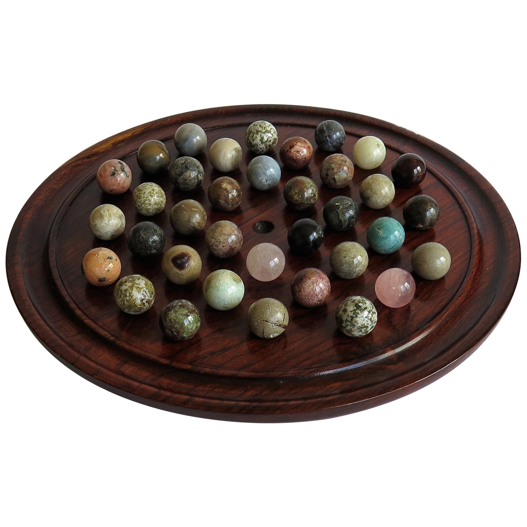Marble Solitaire Game Polished Hardwood Board 36 Agate Stone Marbles, circa 1915