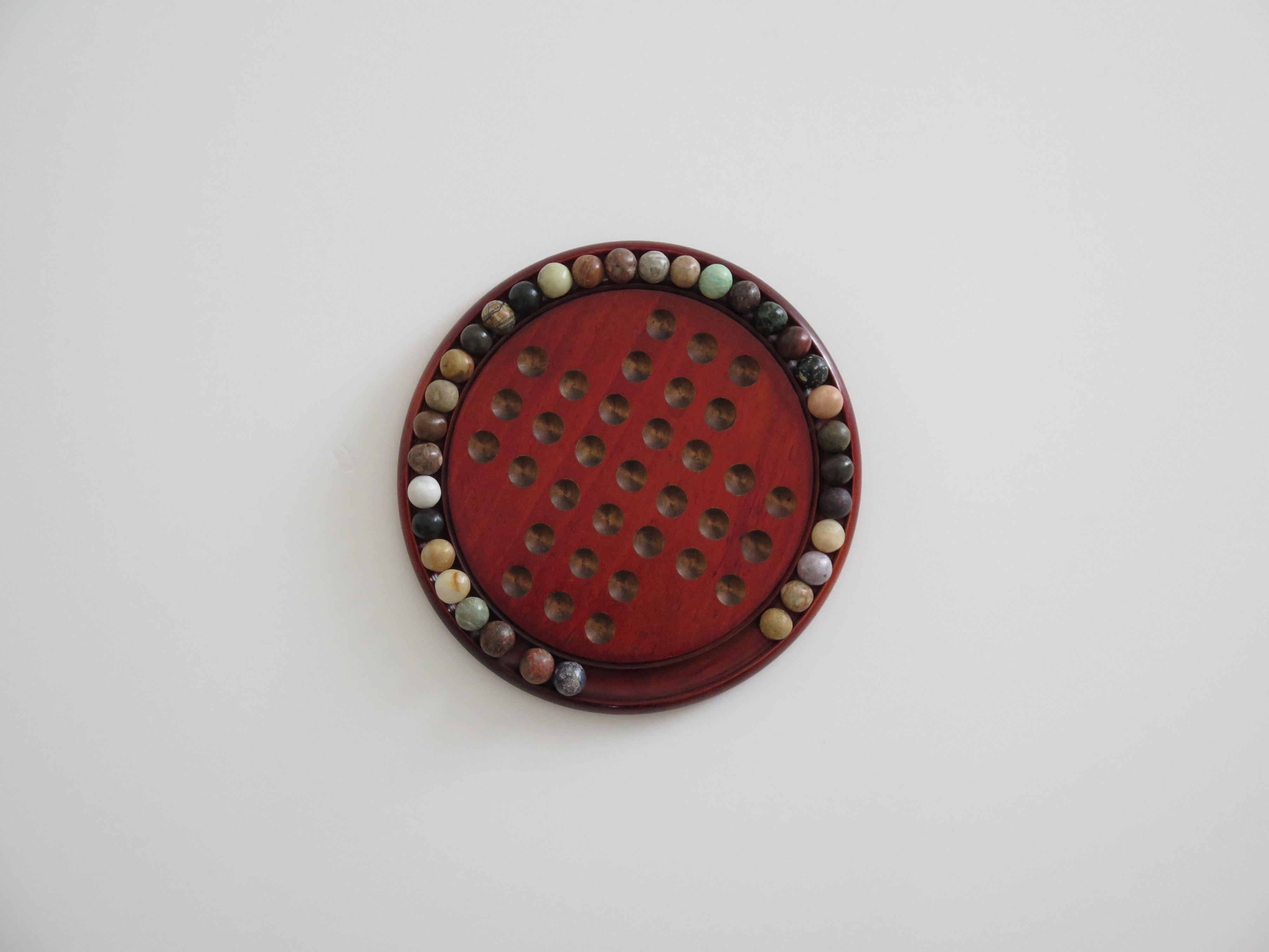 Marble Solitaire Game with hardwood board and 33 agate stone Marbles, Circa 1925 For Sale 5