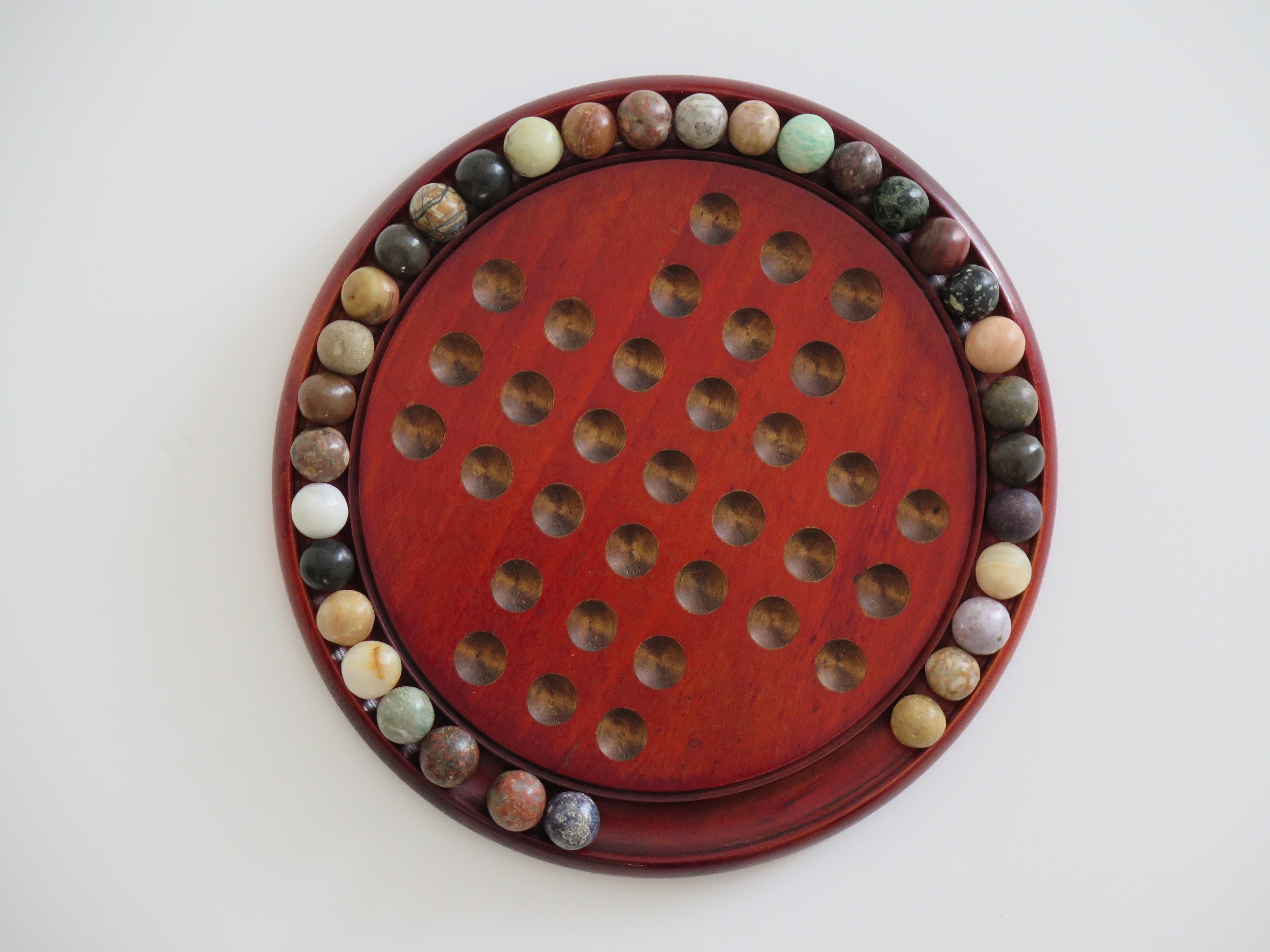 Marble Solitaire Game with hardwood board and 33 agate stone Marbles, Circa 1925 For Sale 6