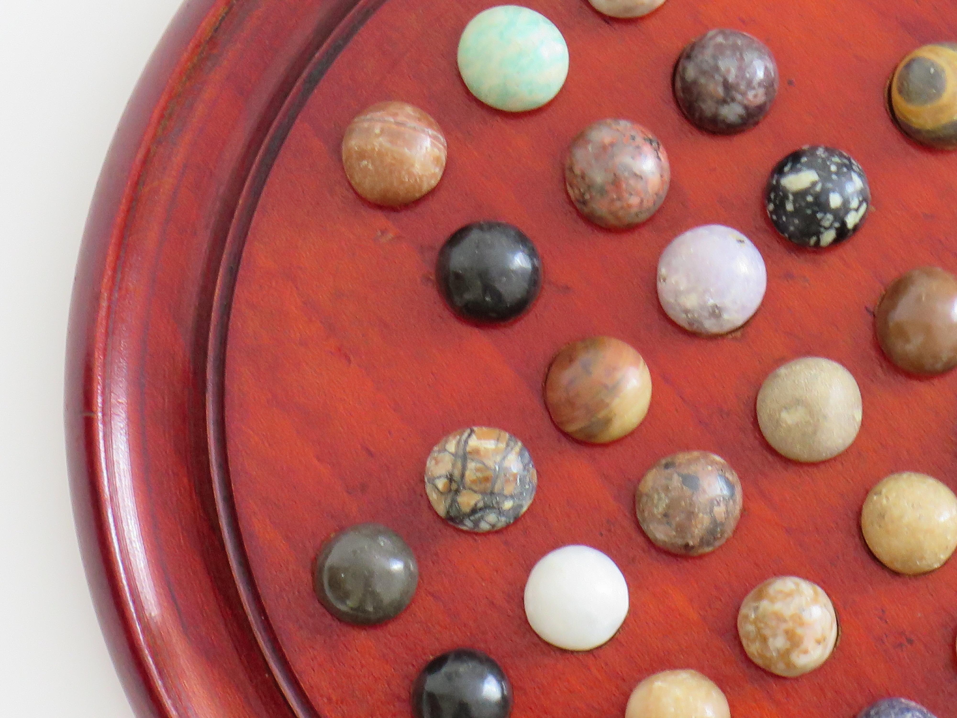 Marble Solitaire Game with hardwood board and 33 agate stone Marbles, Circa 1925 For Sale 1